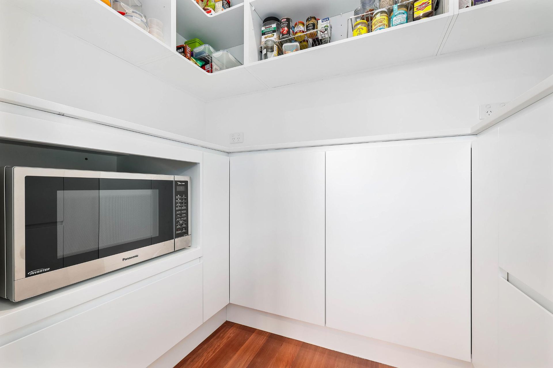 Bright White Closet or Pantry with Shelves — Above & Beyond Interiors in Smeaton Grange, NSW