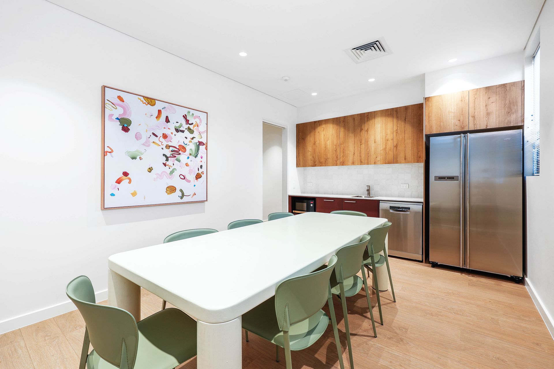 Modern Kitchen and Dining Area With White Table — Above & Beyond Interiors in Smeaton Grange, NSW