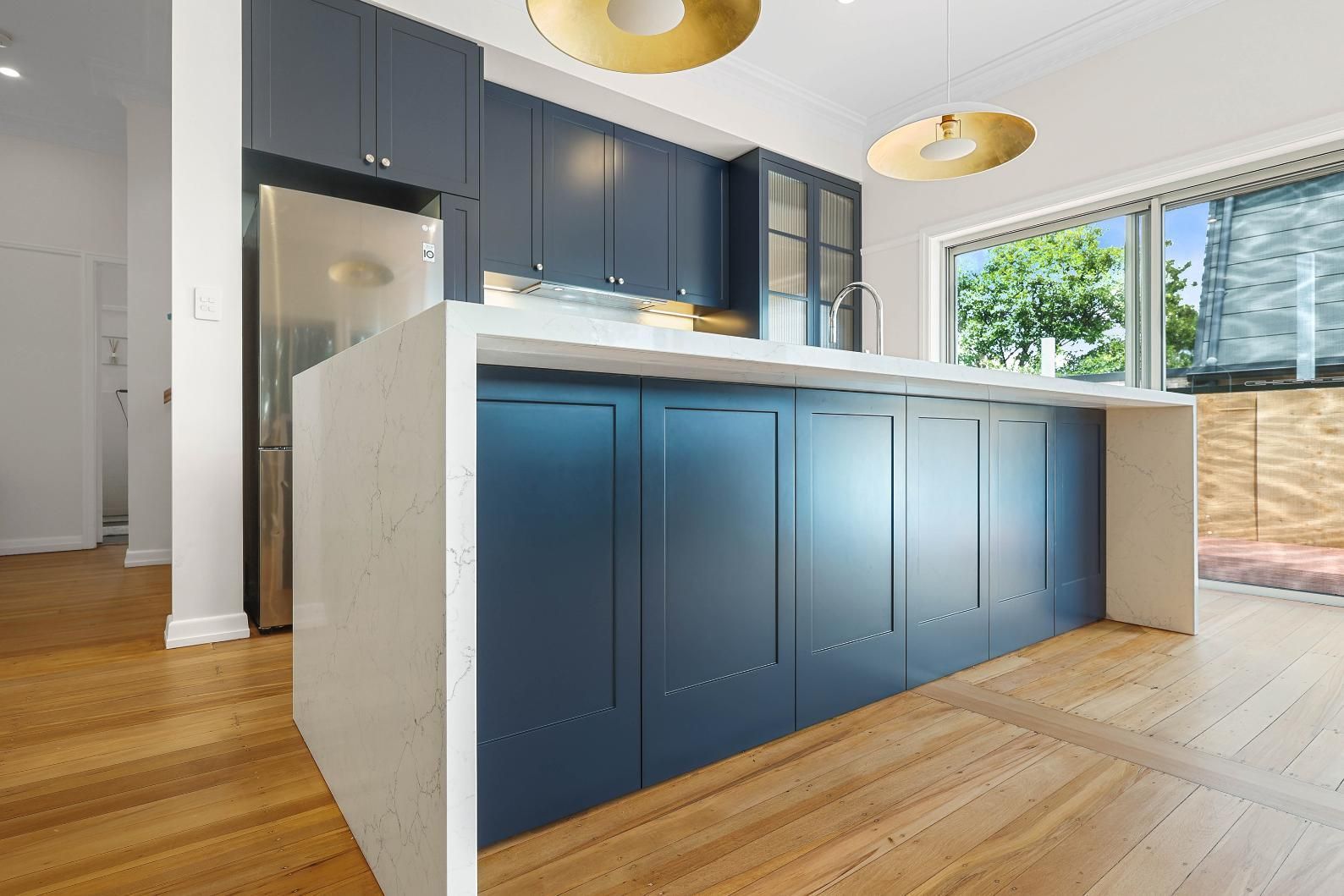 Modern Kitchen With Blue Cabinets, White Countertops — Above & Beyond Interiors in Smeaton Grange, NSW