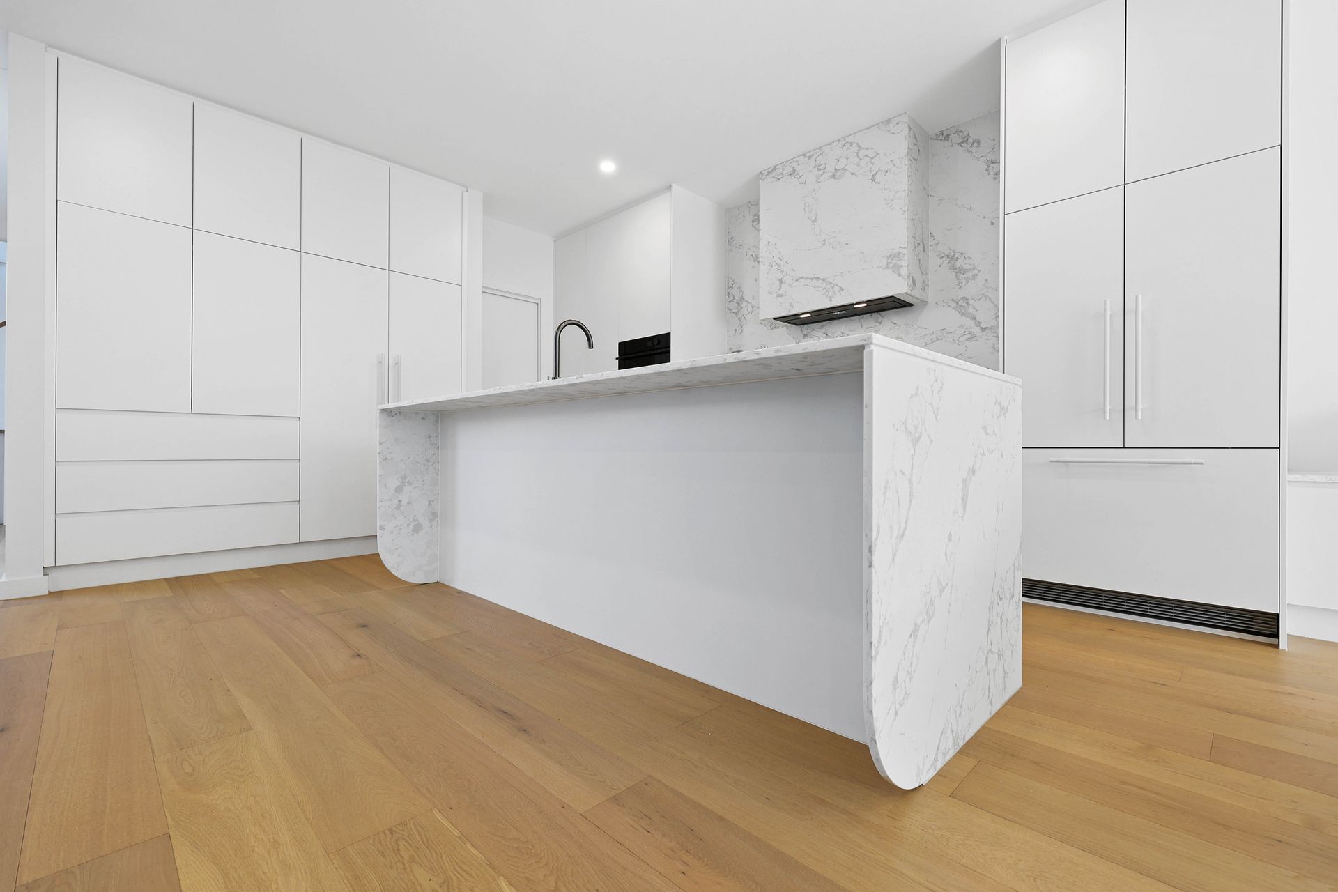 Bright Modern White Kitchen With an Island — Above & Beyond Interiors in Smeaton Grange, NSW