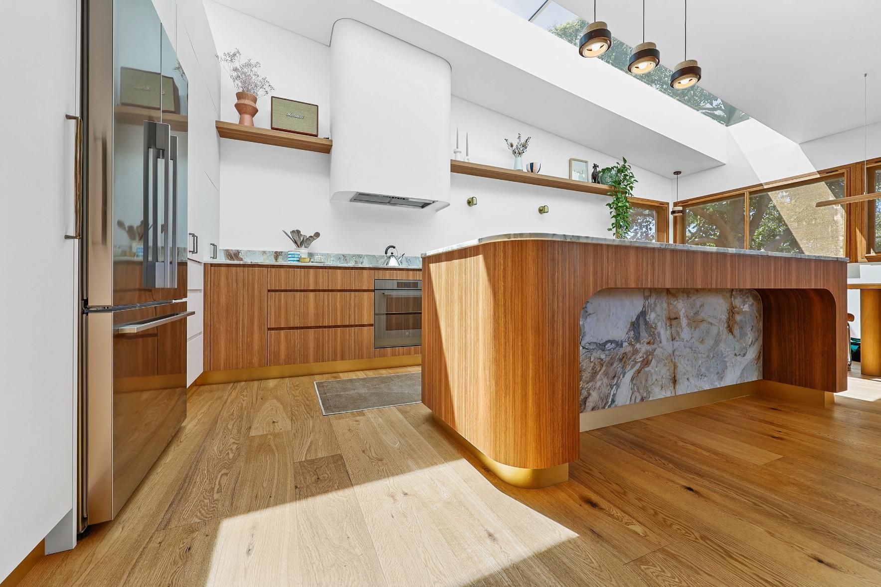 Bright Modern Kitchen With Wood Cabinets — Above & Beyond Interiors in Smeaton Grange, NSW