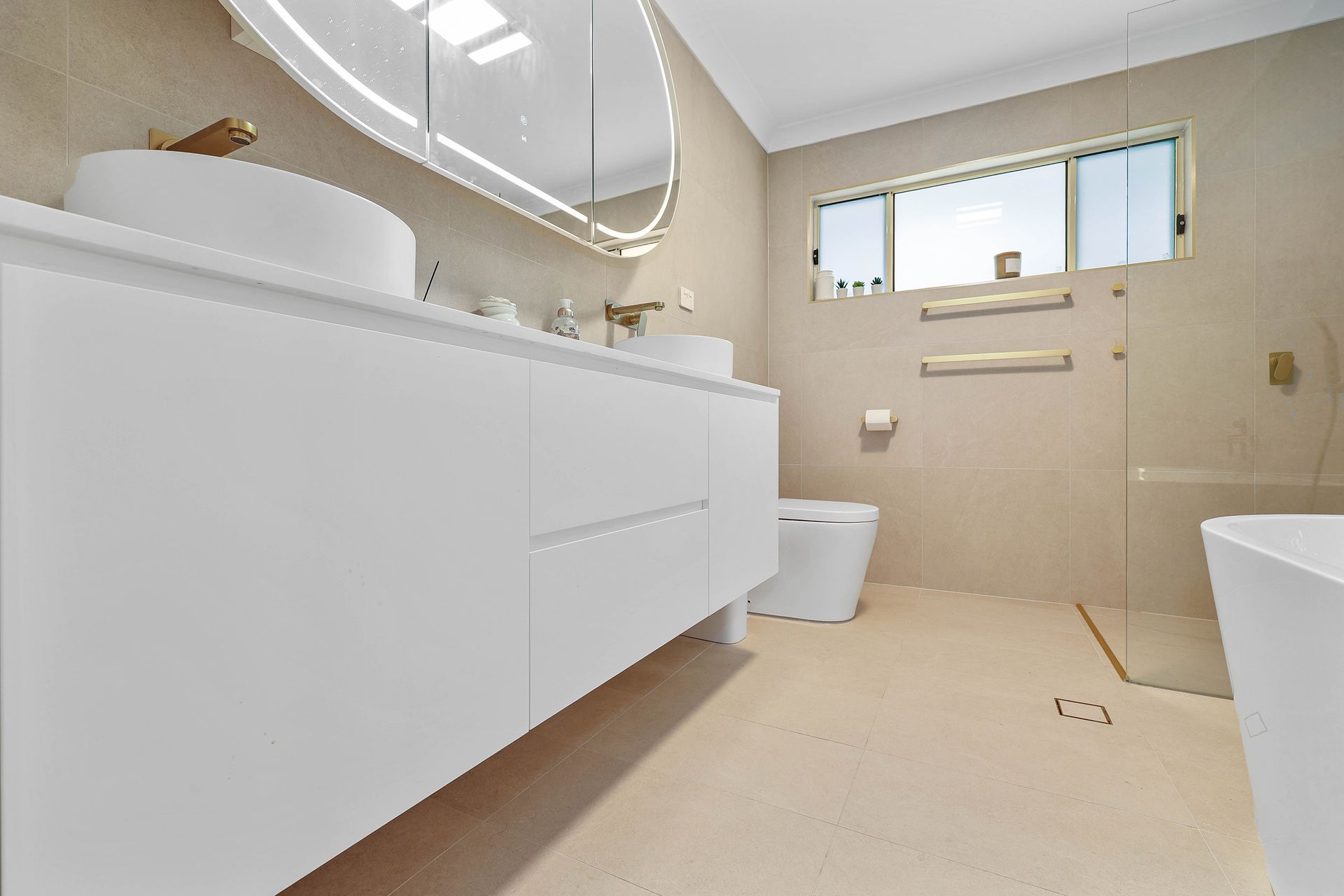 Modern Beige Bathroom With White Vanity — Above & Beyond Interiors in Smeaton Grange, NSW