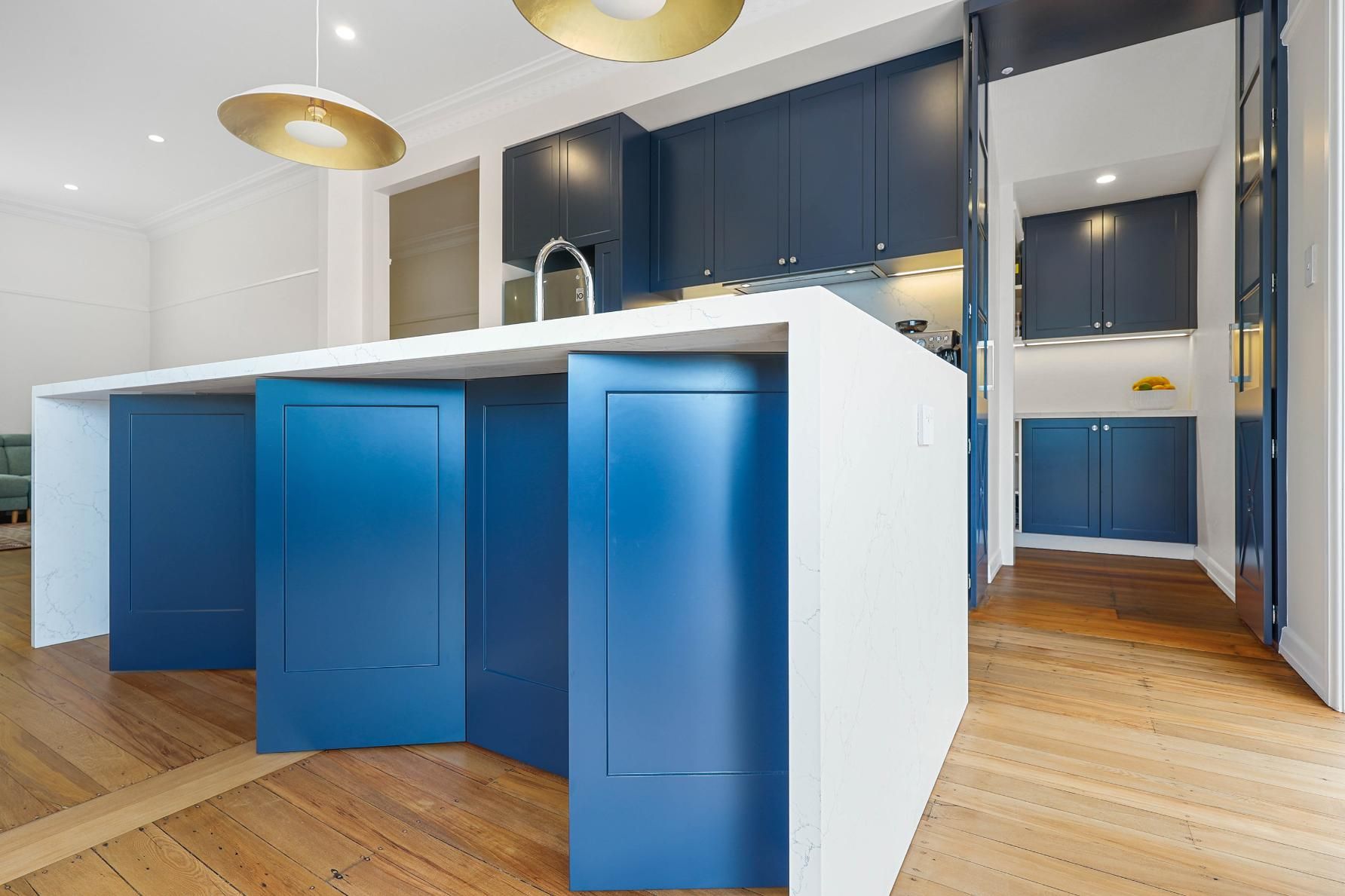 Modern Kitchen With Blue Cabinets, White Island — Above & Beyond Interiors in Smeaton Grange, NSW