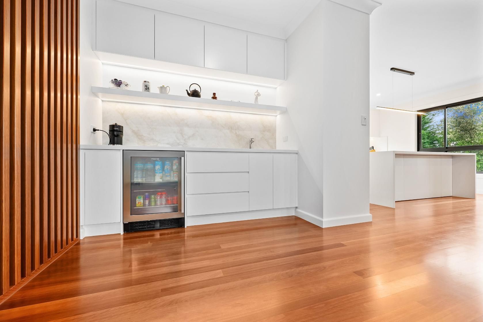 Modern Open-Plan Kitchen with White Cabinets — Above & Beyond Interiors in Smeaton Grange, NSW
