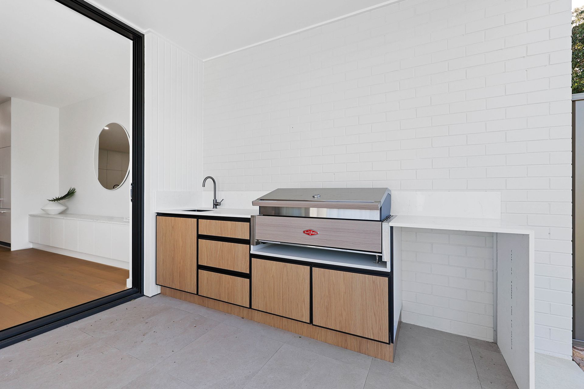 Modern Kitchenette With Wood Cabinets — Above & Beyond Interiors in Smeaton Grange, NSW
