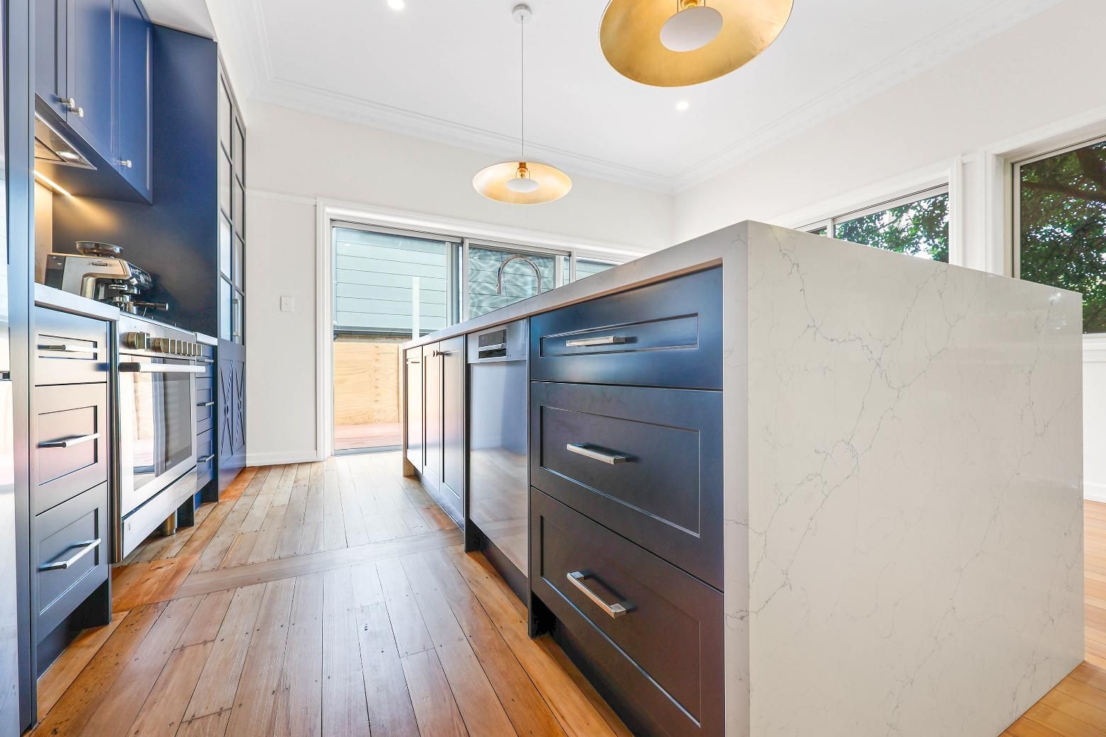 Modern Kitchen With Blue Cabinets, White Island — Above & Beyond Interiors in Smeaton Grange, NSW