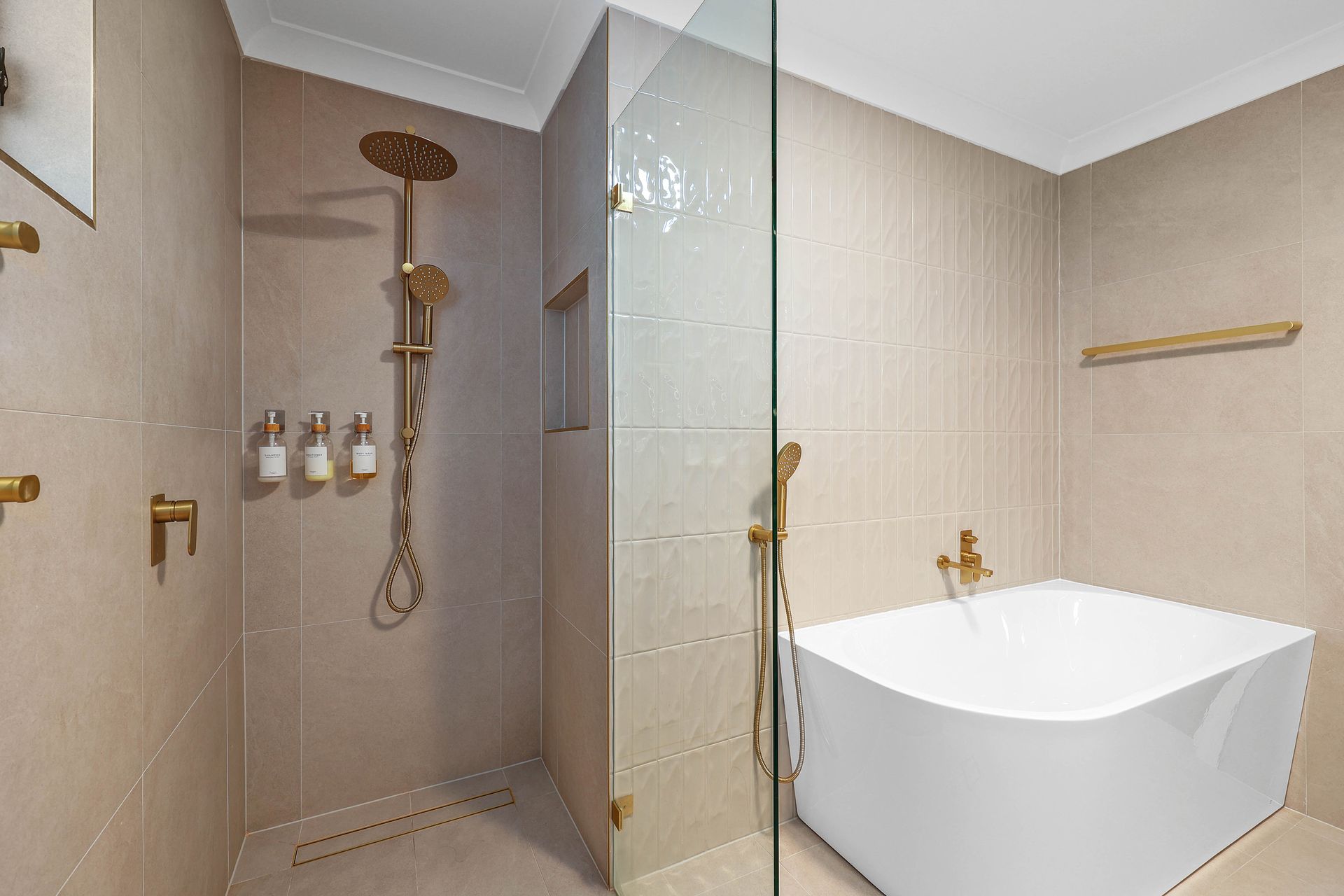 Modern Bathroom With Glass Shower, Gold Fixtures — Above & Beyond Interiors in Smeaton Grange, NSW