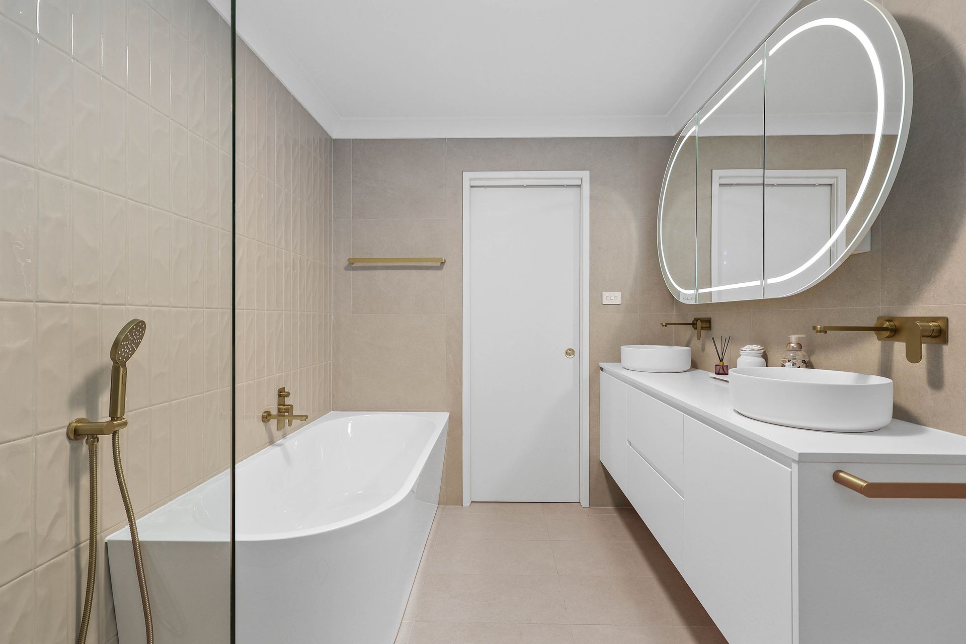 Modern Beige Bathroom With Freestanding Tub — Above & Beyond Interiors in Smeaton Grange, NSW