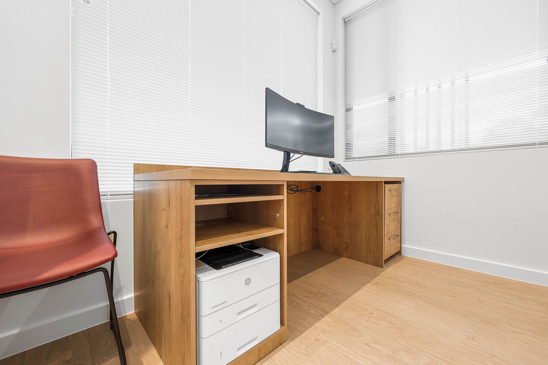 Small Office Corner With Wooden Desk — Above & Beyond Interiors in Smeaton Grange, NSW