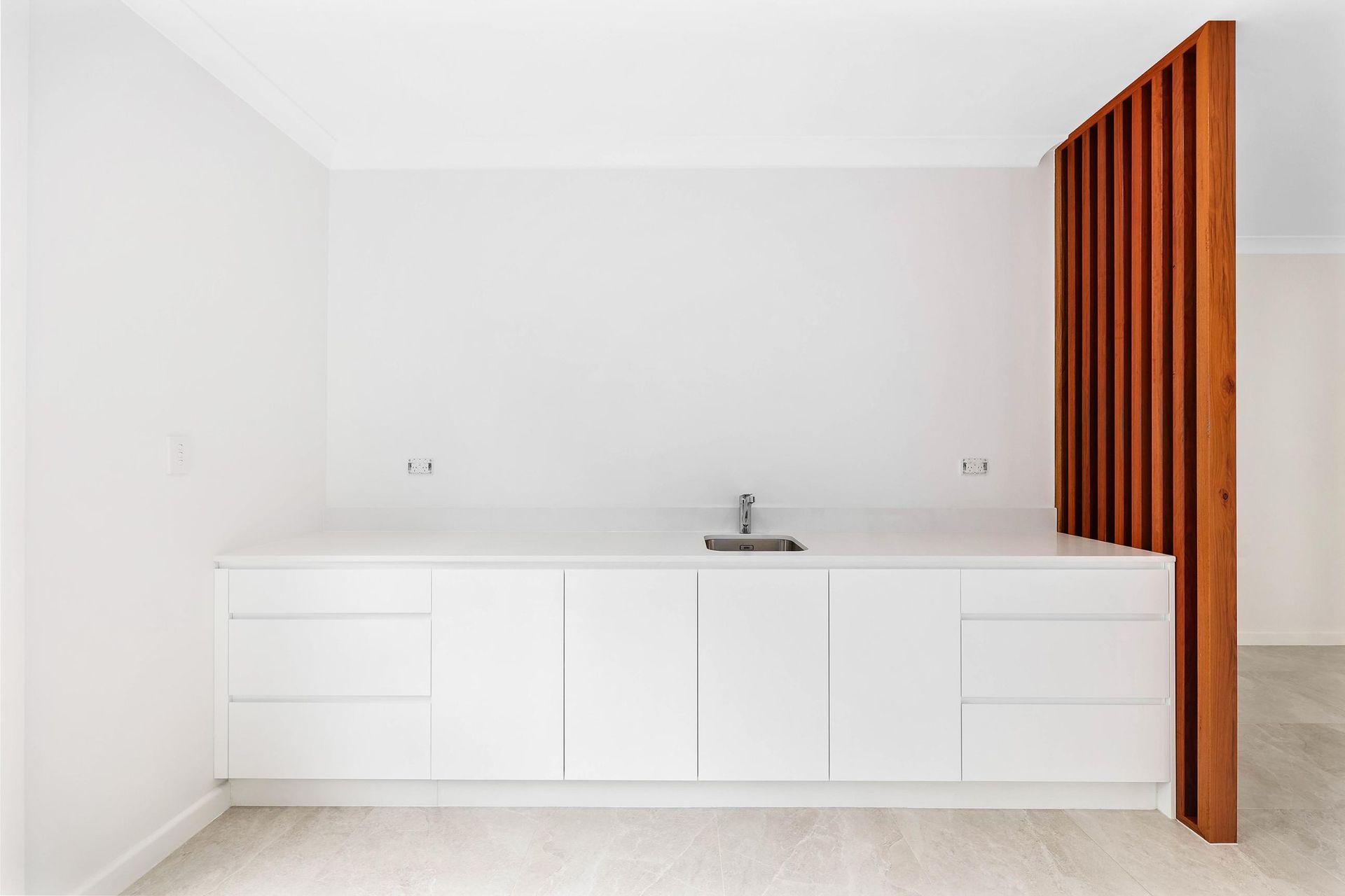 Minimal White Kitchen with A Sink — Above & Beyond Interiors in Smeaton Grange, NSW