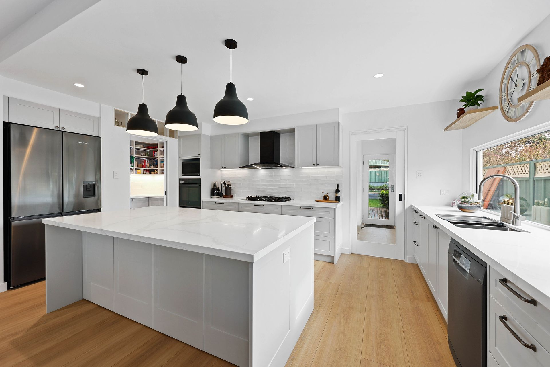 Bright Modern Kitchen with White Cabinets — Above & Beyond Interiors in Smeaton Grange, NSW