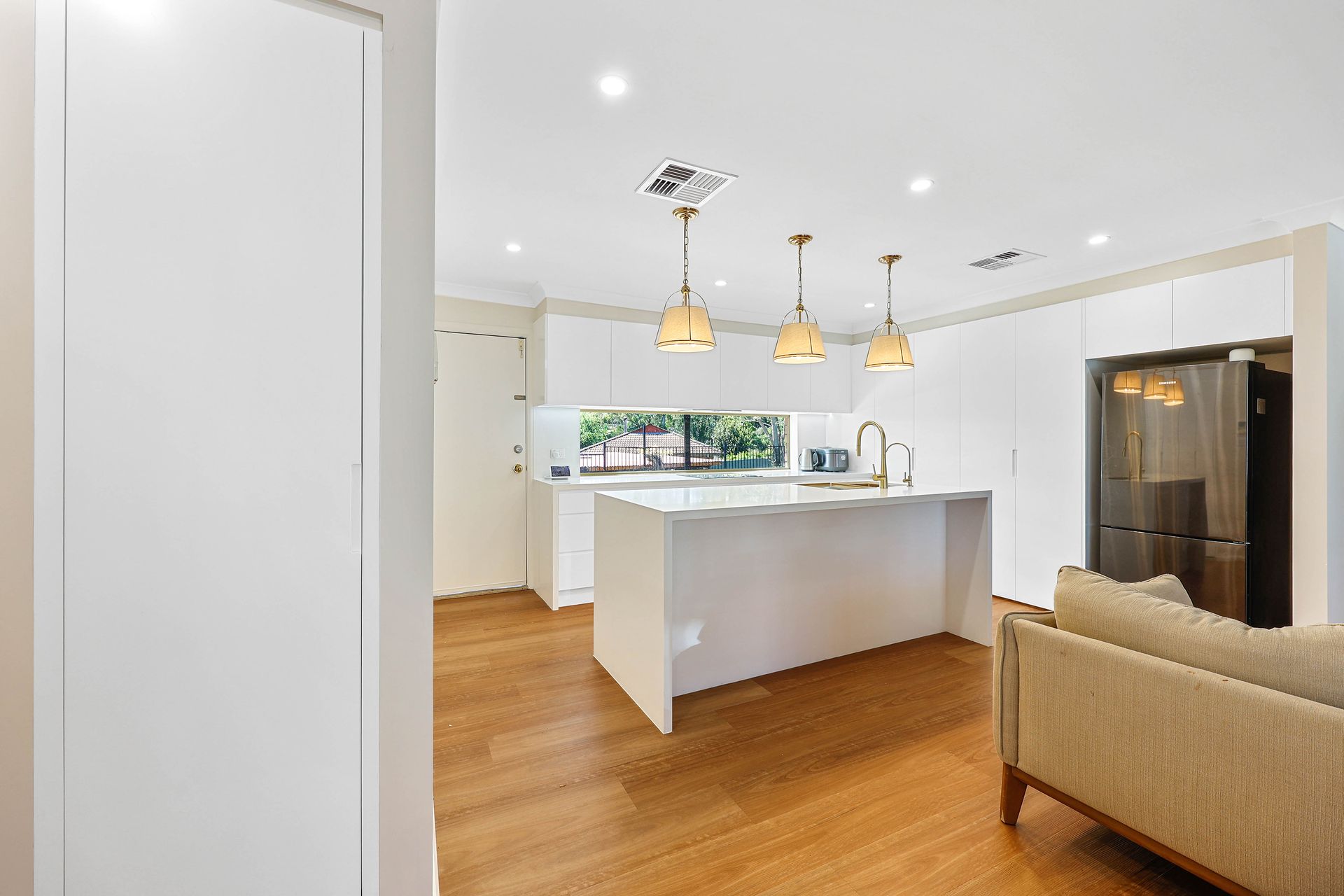 Bright Modern Kitchen With White Island — Above & Beyond Interiors in Smeaton Grange, NSW