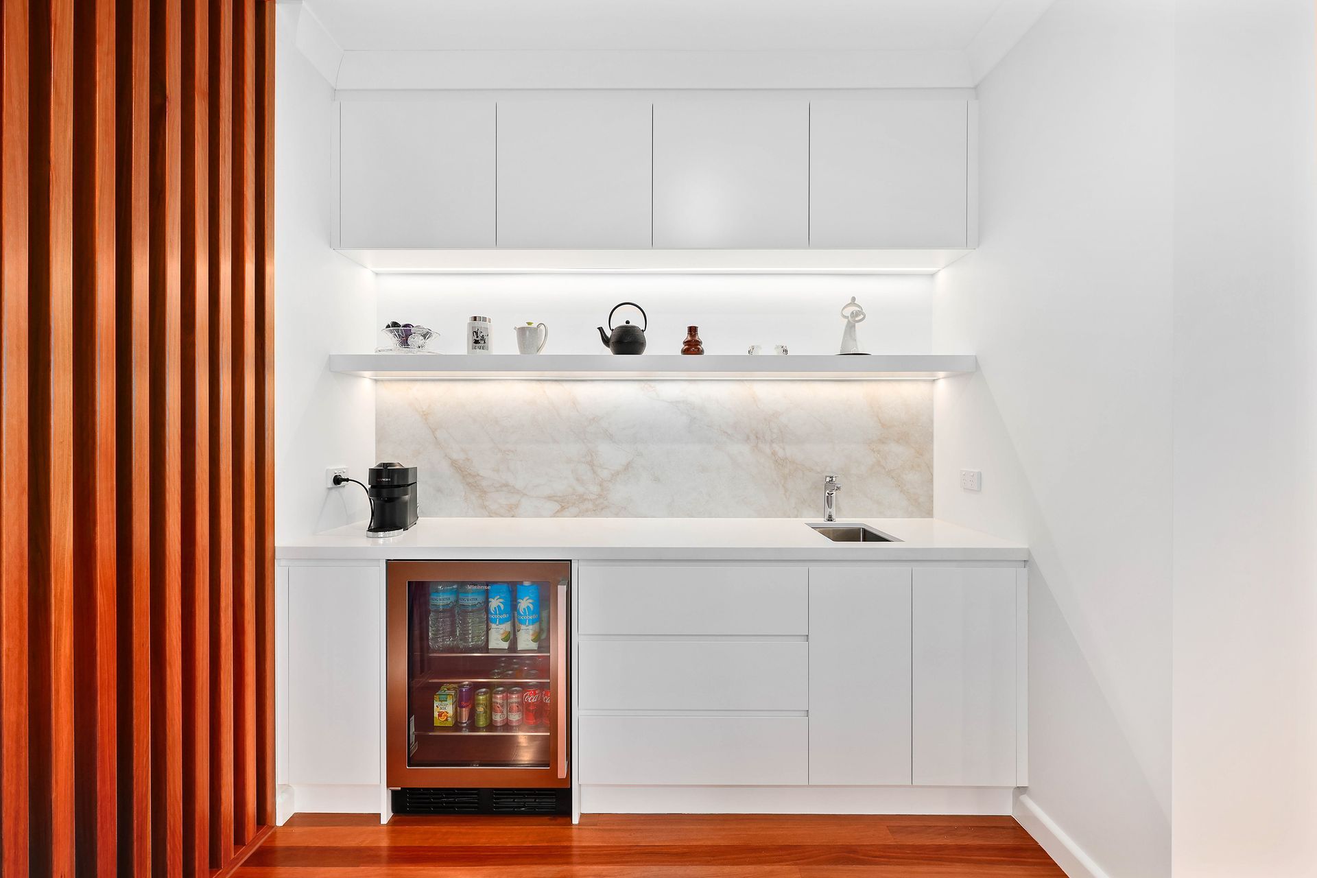 Minimal White Kitchenette with Wood Floor — Above & Beyond Interiors in Smeaton Grange, NSW