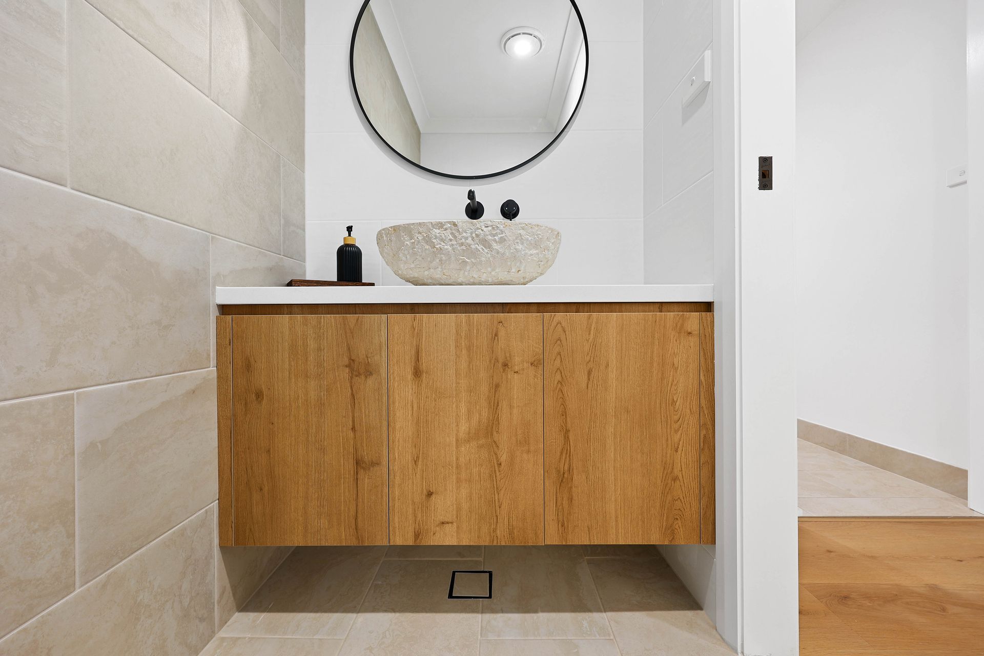 A Bathroom Vanity with Wood Cabinet — Above & Beyond Interiors in Smeaton Grange, NSW