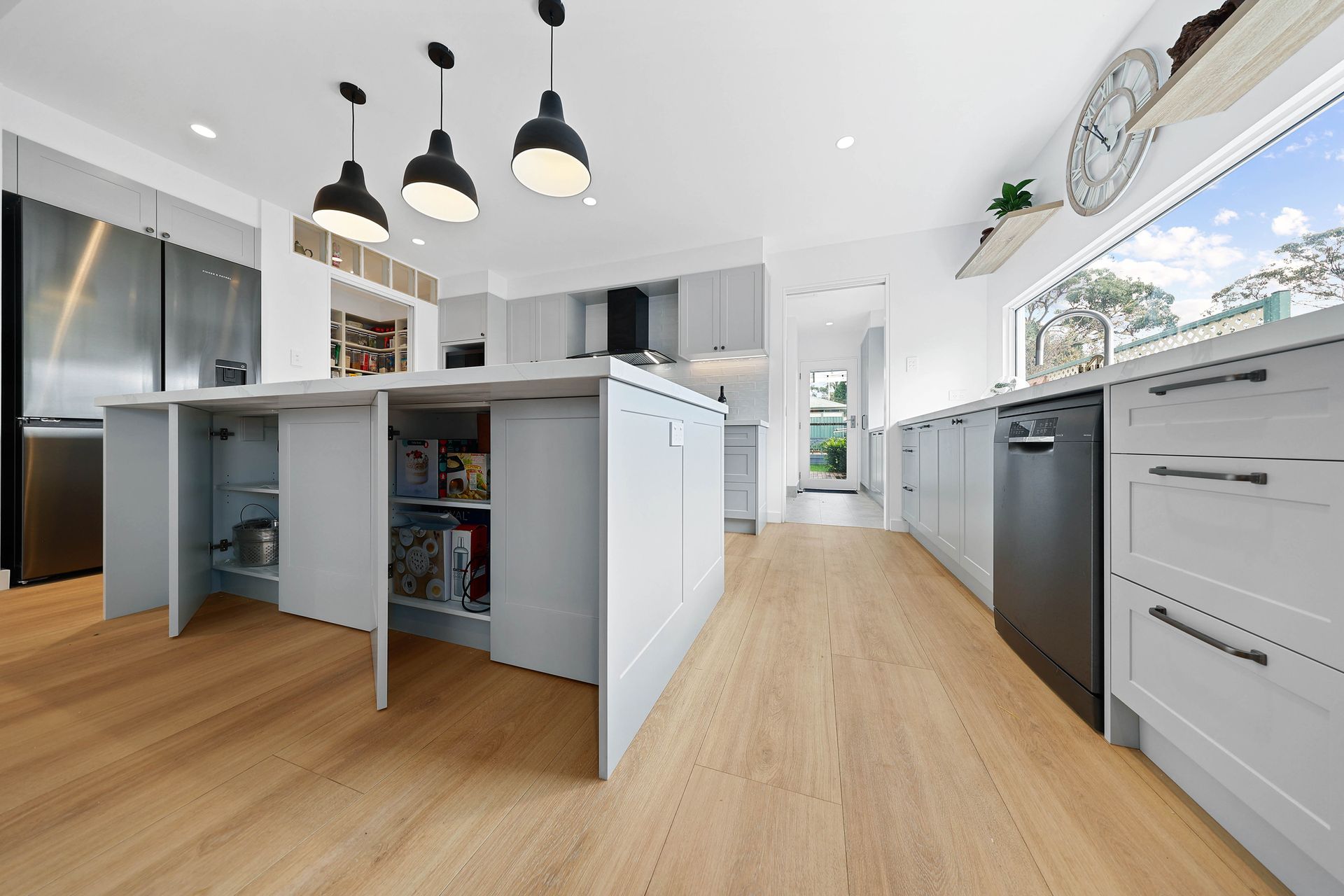 Bright Modern Kitchen with A Central Island — Above & Beyond Interiors in Smeaton Grange, NSW