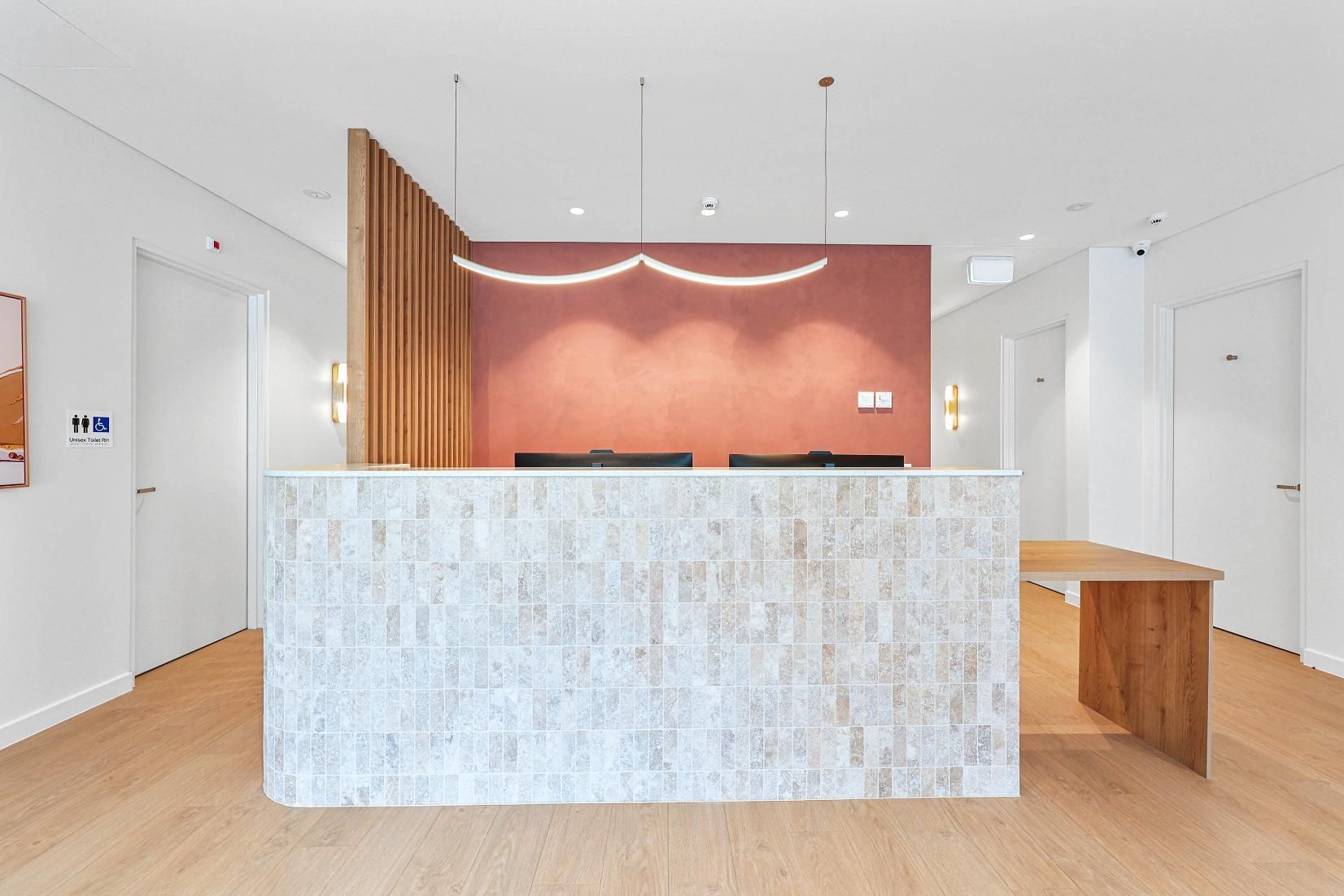 Bright, Modern Reception Desk With White Stone Front — Above & Beyond Interiors in Smeaton Grange, NSW