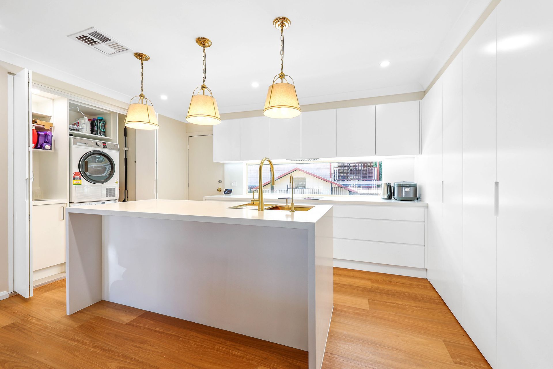 Bright Modern Kitchen With White Cabinets — Above & Beyond Interiors in Smeaton Grange, NSW