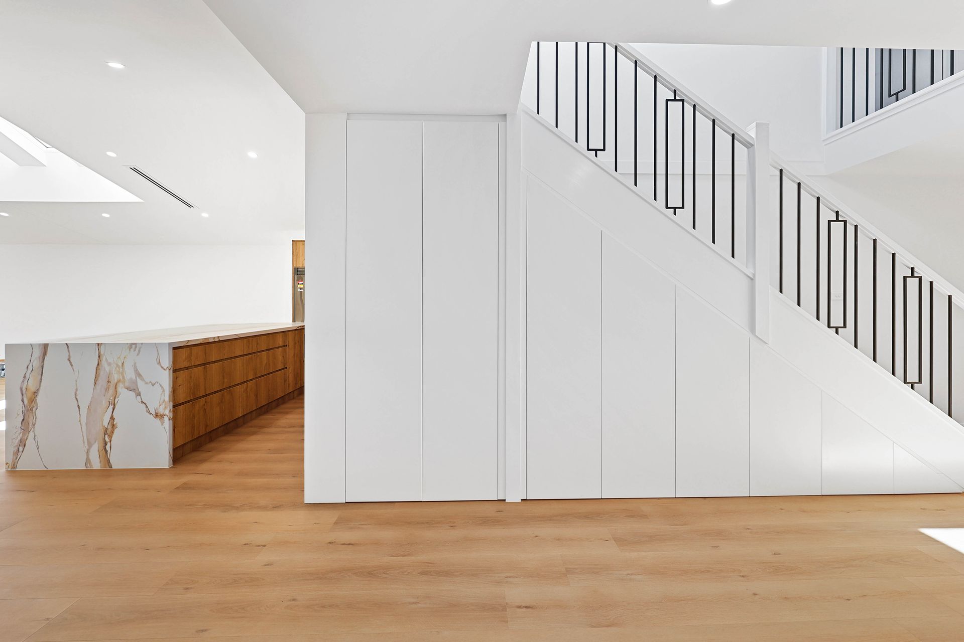 A Modern White Interior with Wood Floors — Above & Beyond Interiors in Smeaton Grange, NSW