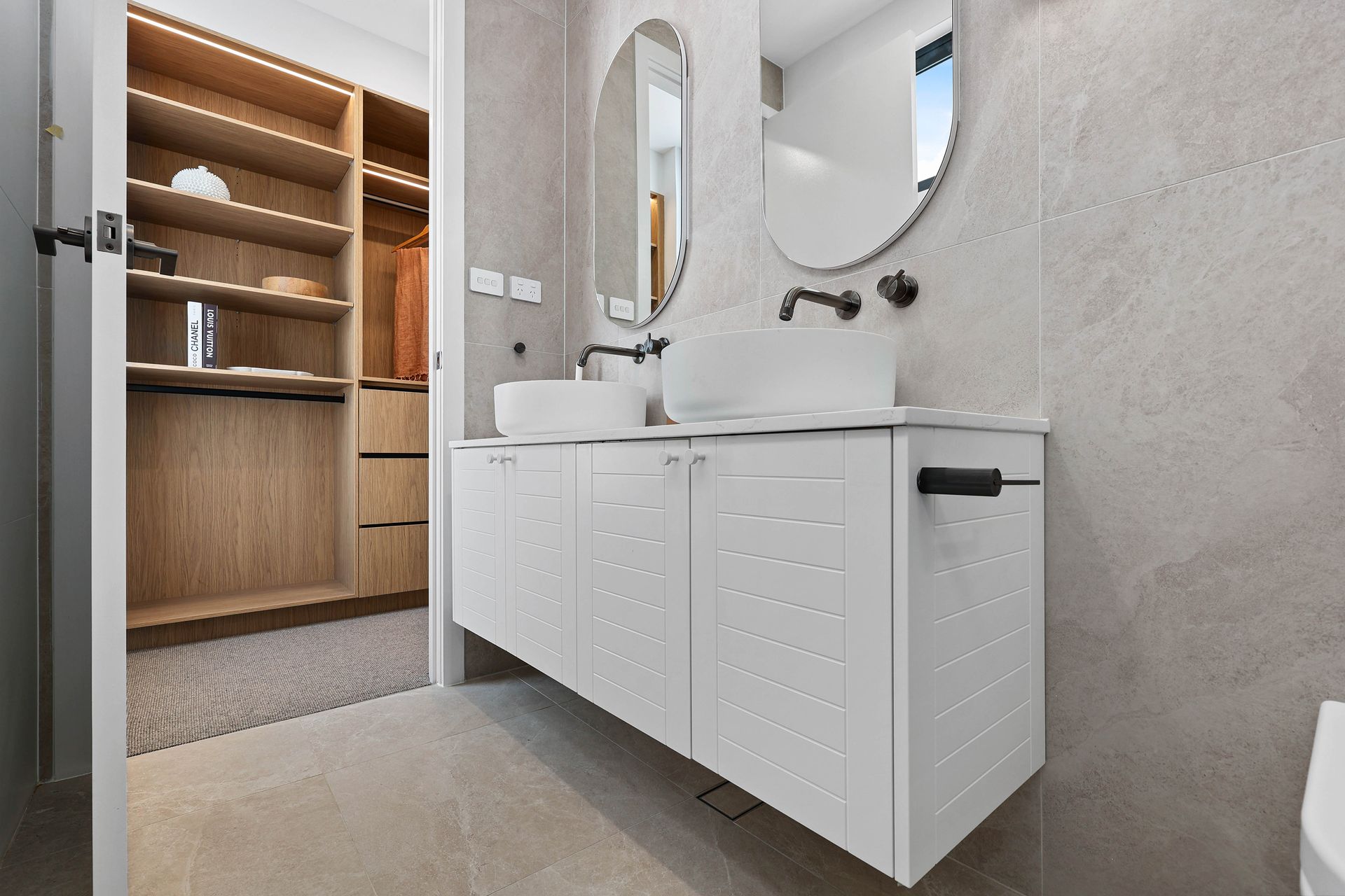 Modern Bathroom With White Vanity, Round Mirror — Above & Beyond Interiors in Smeaton Grange, NSW