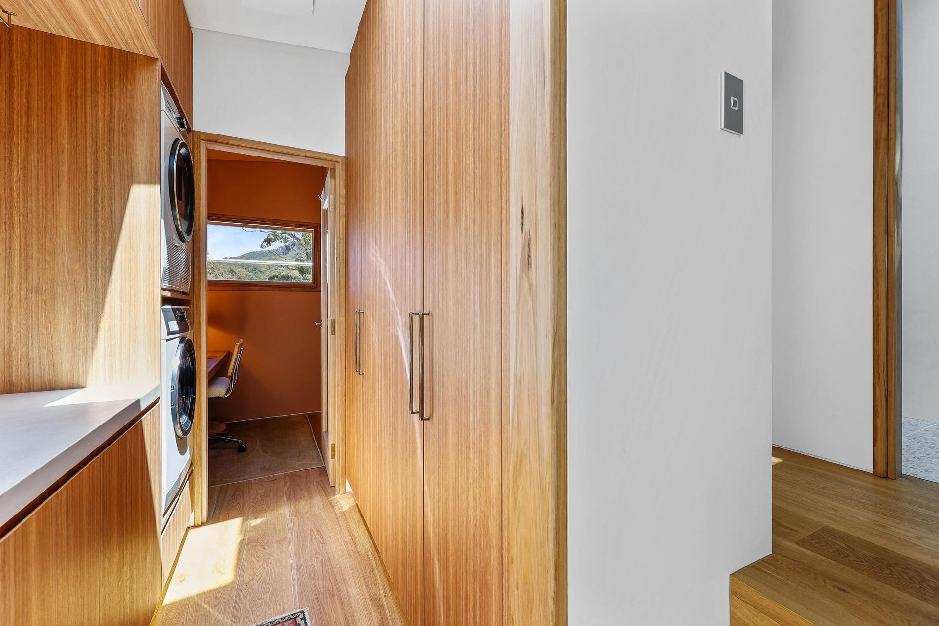 Narrow Wooden Hallway With Built-in Cabinets — Above & Beyond Interiors in Smeaton Grange, NSW