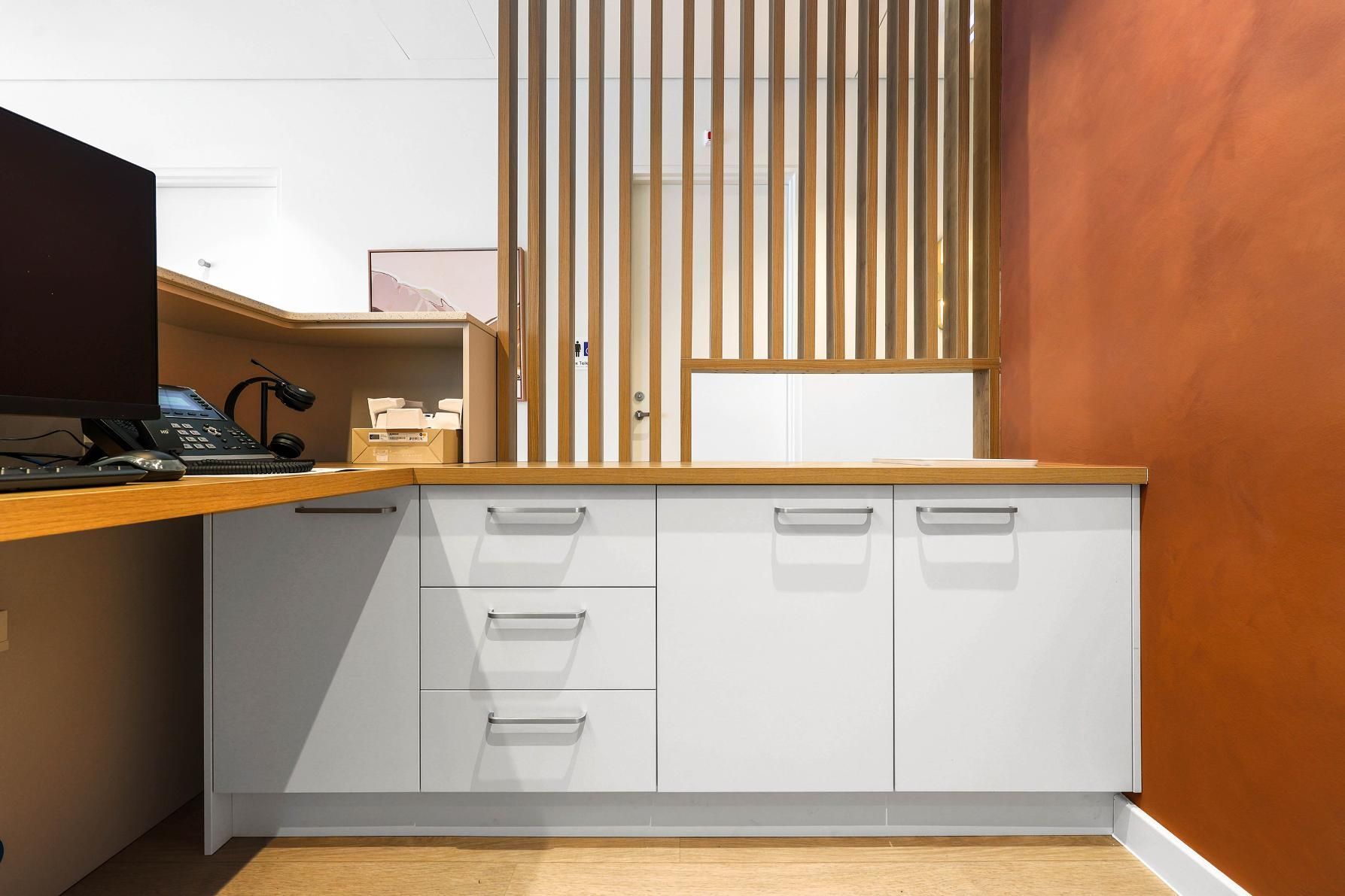 Modern Office Storage Cabinets Beneath a Wood Countertop — Above & Beyond Interiors in Smeaton Grange, NSW