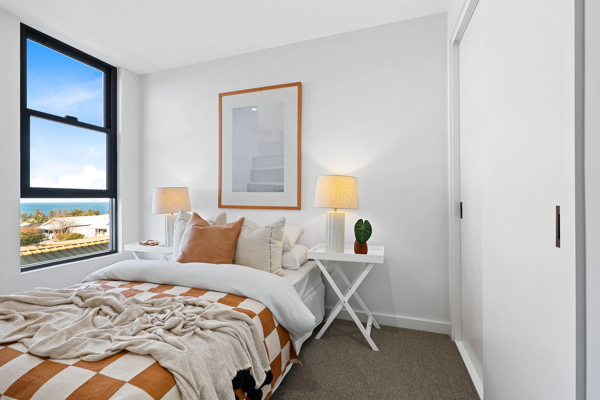 Bright Bedroom With White Bedding, Tan Accents — Above & Beyond Interiors in Smeaton Grange, NSW