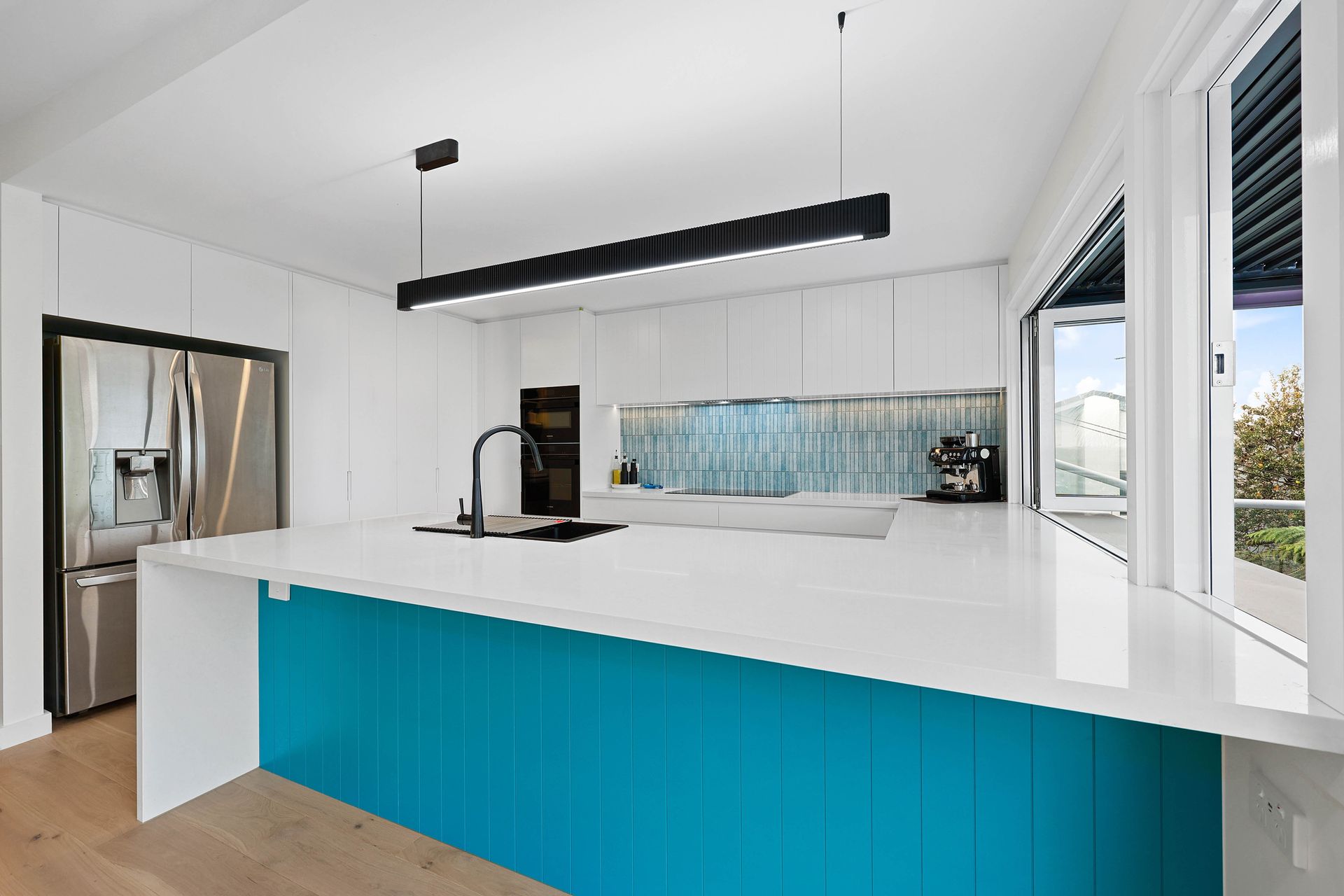 Modern Kitchen with White Island — Above & Beyond Interiors in Smeaton Grange, NSW