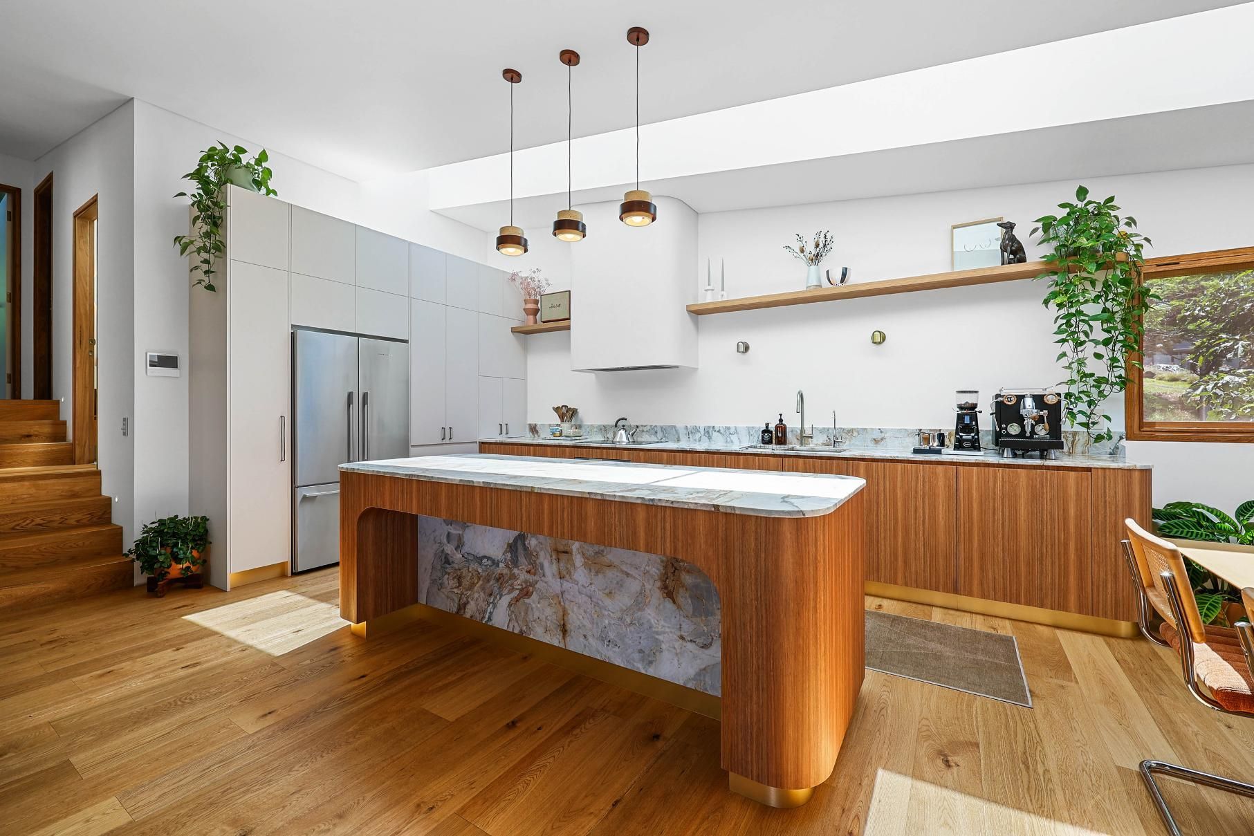 Modern Kitchen With Wood Island, Stainless Fridge — Above & Beyond Interiors in Smeaton Grange, NSW