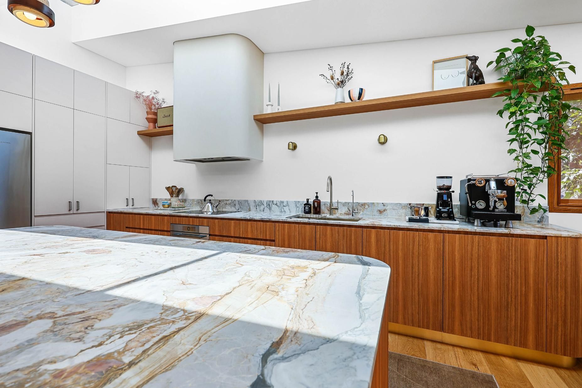 Modern Kitchen With Marble Island, Wood Cabinets — Above & Beyond Interiors in Smeaton Grange, NSW