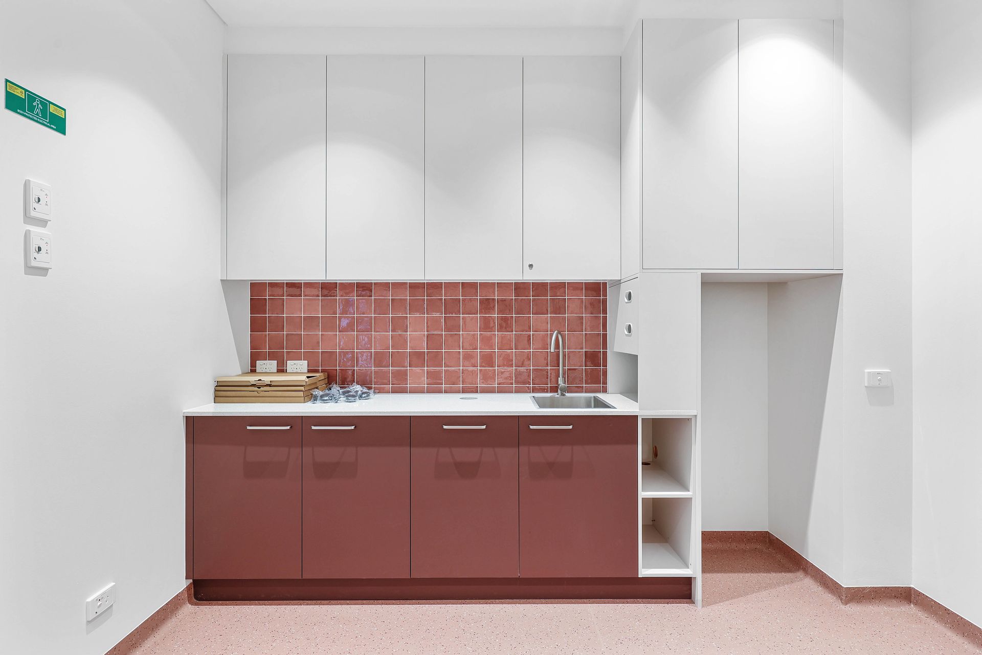 Compact Kitchenette With Maroon Cabinets — Above & Beyond Interiors in Smeaton Grange, NSW