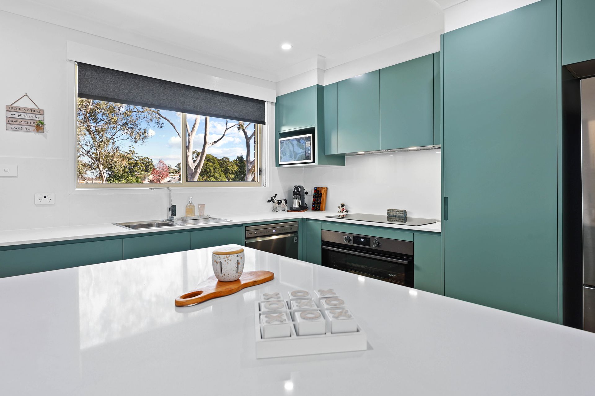 Modern Kitchen With Teal Cabinets, White Countertops — Above & Beyond Interiors in Smeaton Grange, NSW