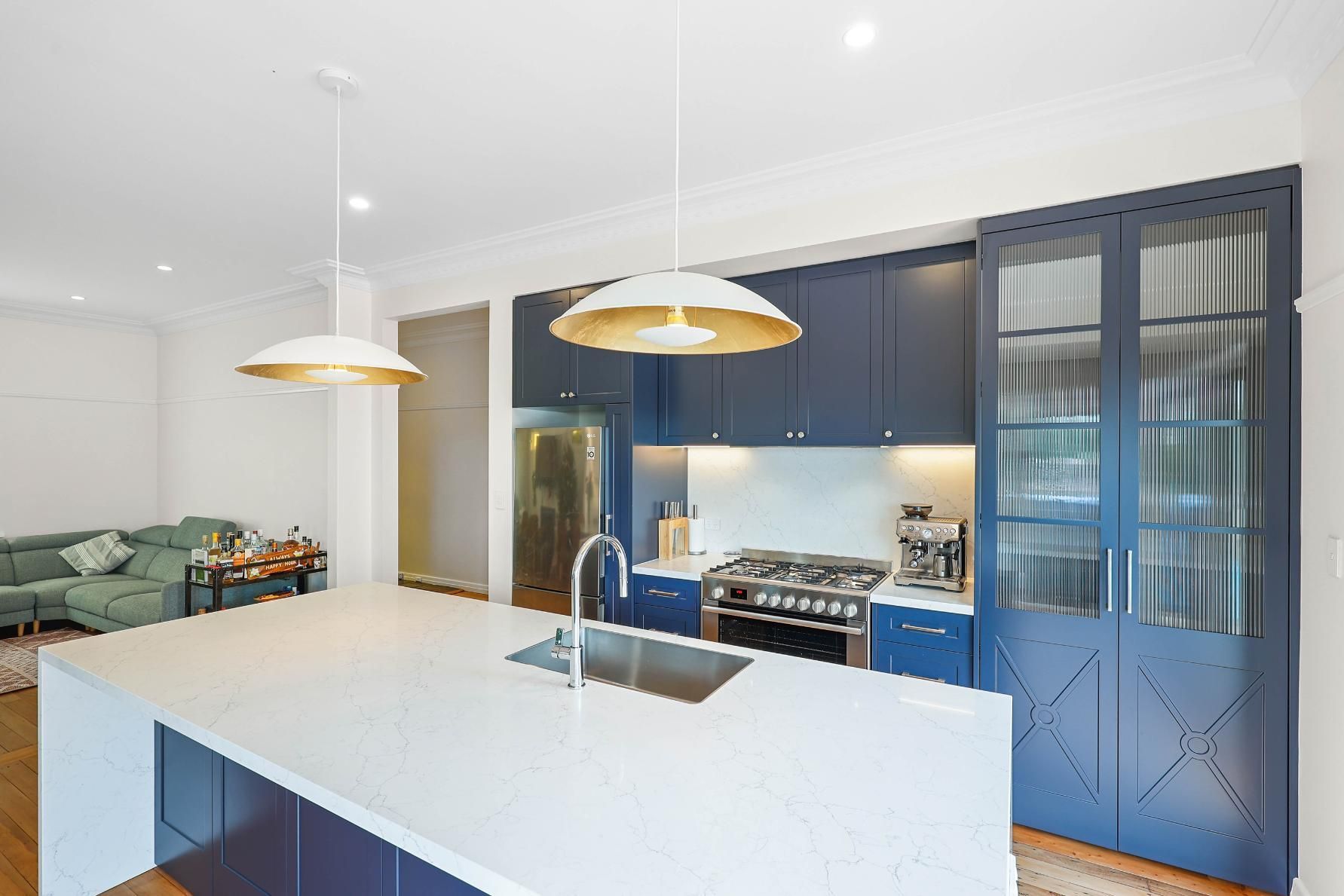 Modern Kitchen With White Island, Blue Cabinets — Above & Beyond Interiors in Smeaton Grange, NSW