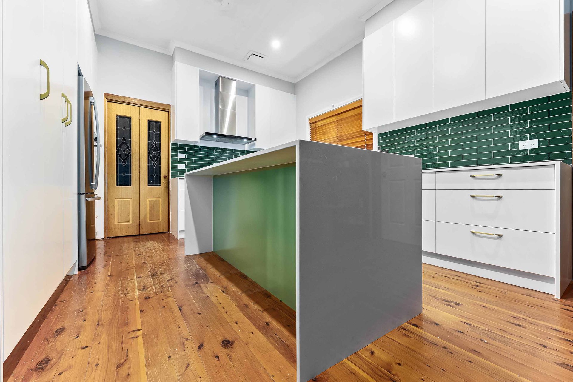 A Bright Modern Kitchen with Green Island — Above & Beyond Interiors in Smeaton Grange, NSW