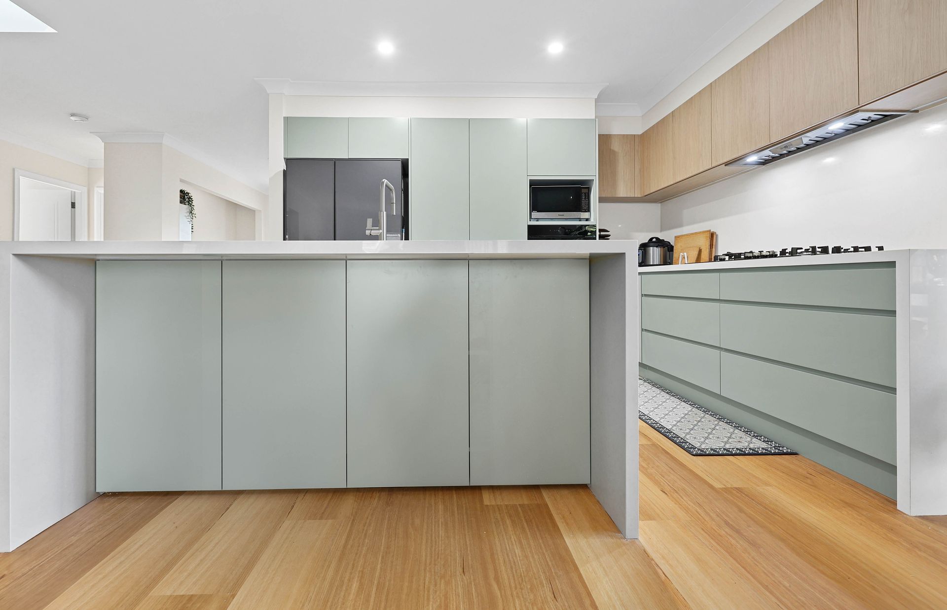 Modern Kitchen with Pale Cabinets — Above & Beyond Interiors in Smeaton Grange, NSW