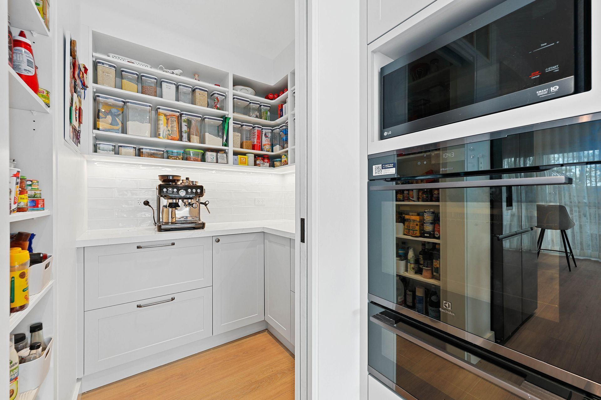 Bright White Pantry and Kitchen Storage with Shelves of Jars — Above & Beyond Interiors in Smeaton Grange, NSW