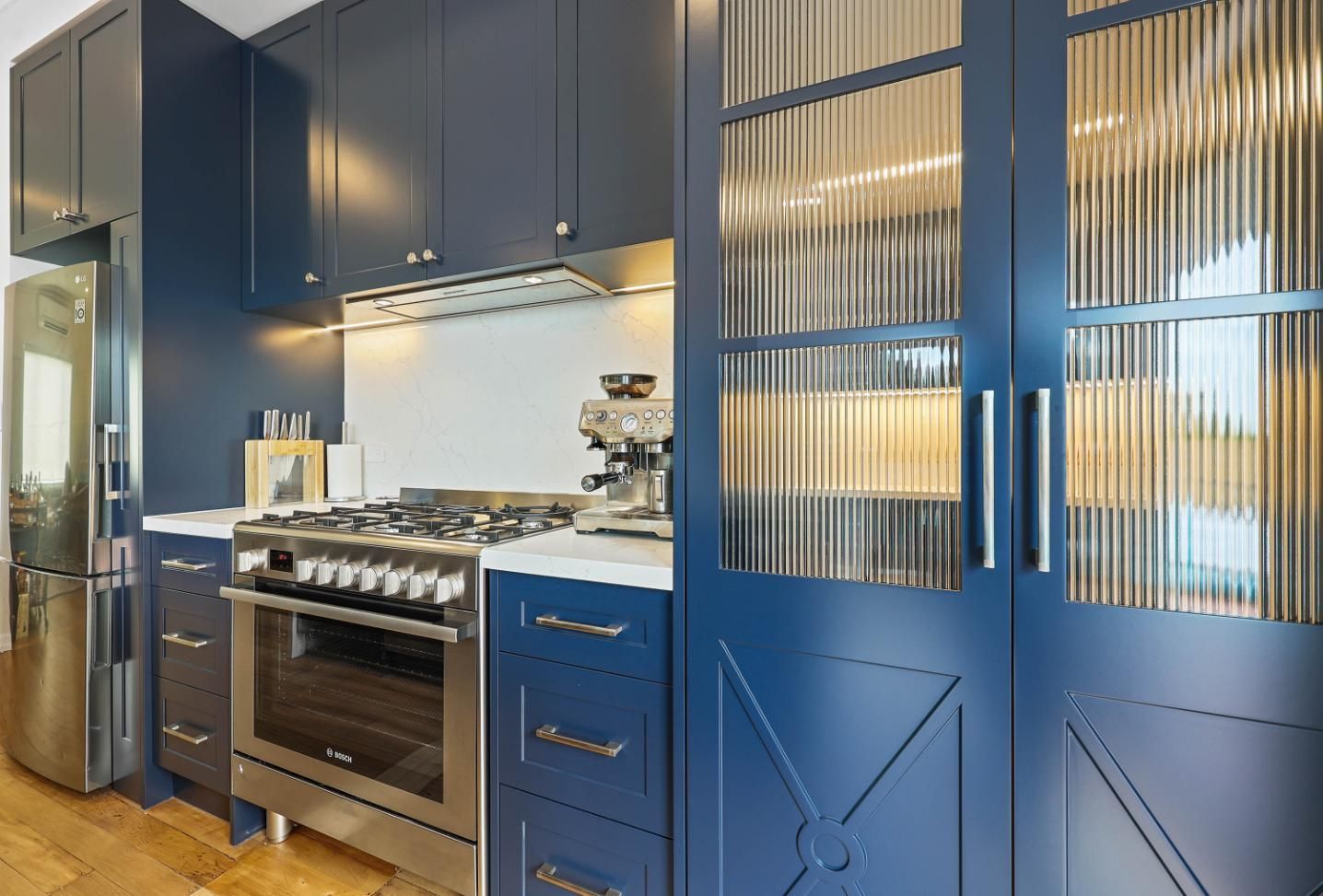 Blue Kitchen With Stainless Steel Stove, Refrigerator — Above & Beyond Interiors in Smeaton Grange, NSW