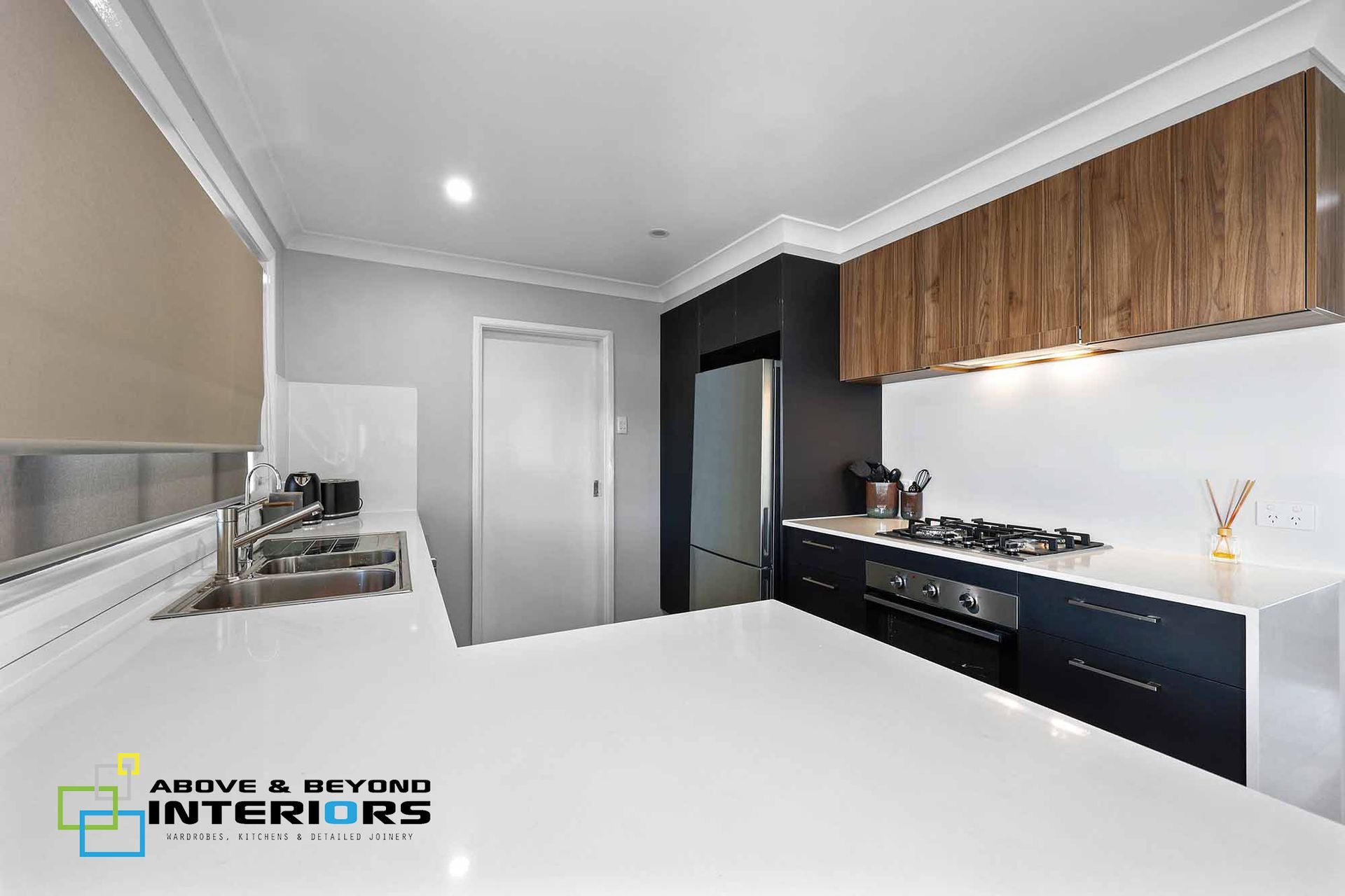 Modern Kitchen with White Island — Above & Beyond Interiors in Smeaton Grange, NSW