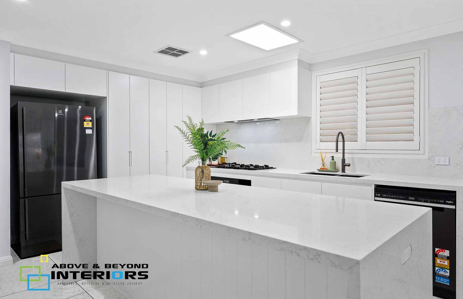 Bright Modern White Kitchen with Island — Above & Beyond Interiors in Smeaton Grange, NSW