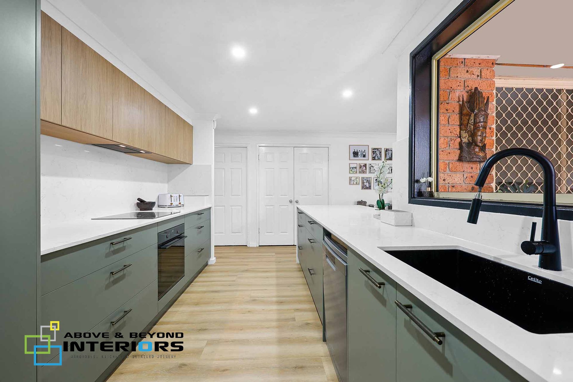 Modern Kitchen with Light Wood Cabinets — Above & Beyond Interiors in Smeaton Grange, NSW