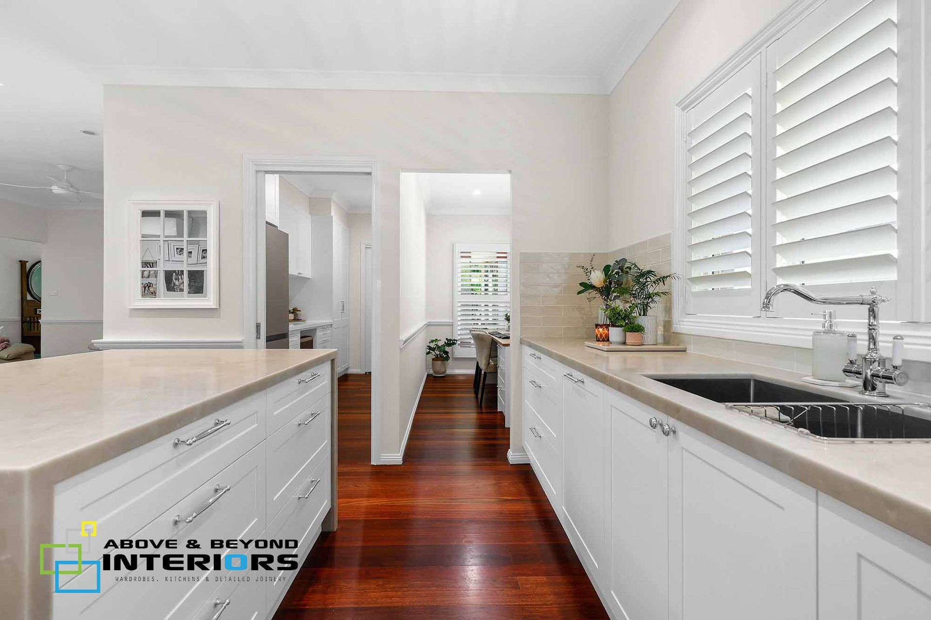 Bright Kitchen with White Cabinets, and Stone Counters — Above & Beyond Interiors in Smeaton Grange, NSW