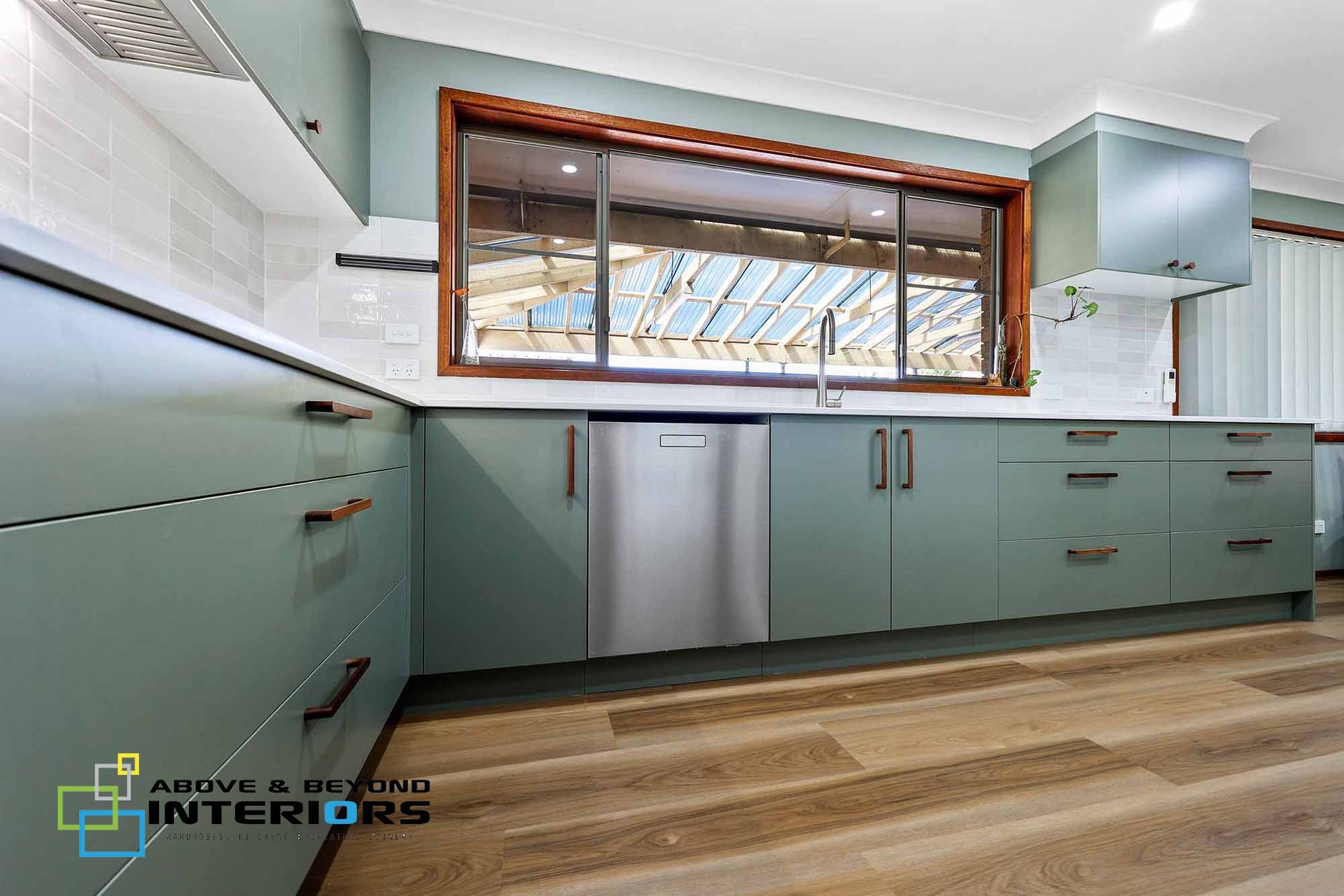 Modern Kitchen with Mint Cabinets, and Wood Floors — Above & Beyond Interiors in Smeaton Grange, NSW