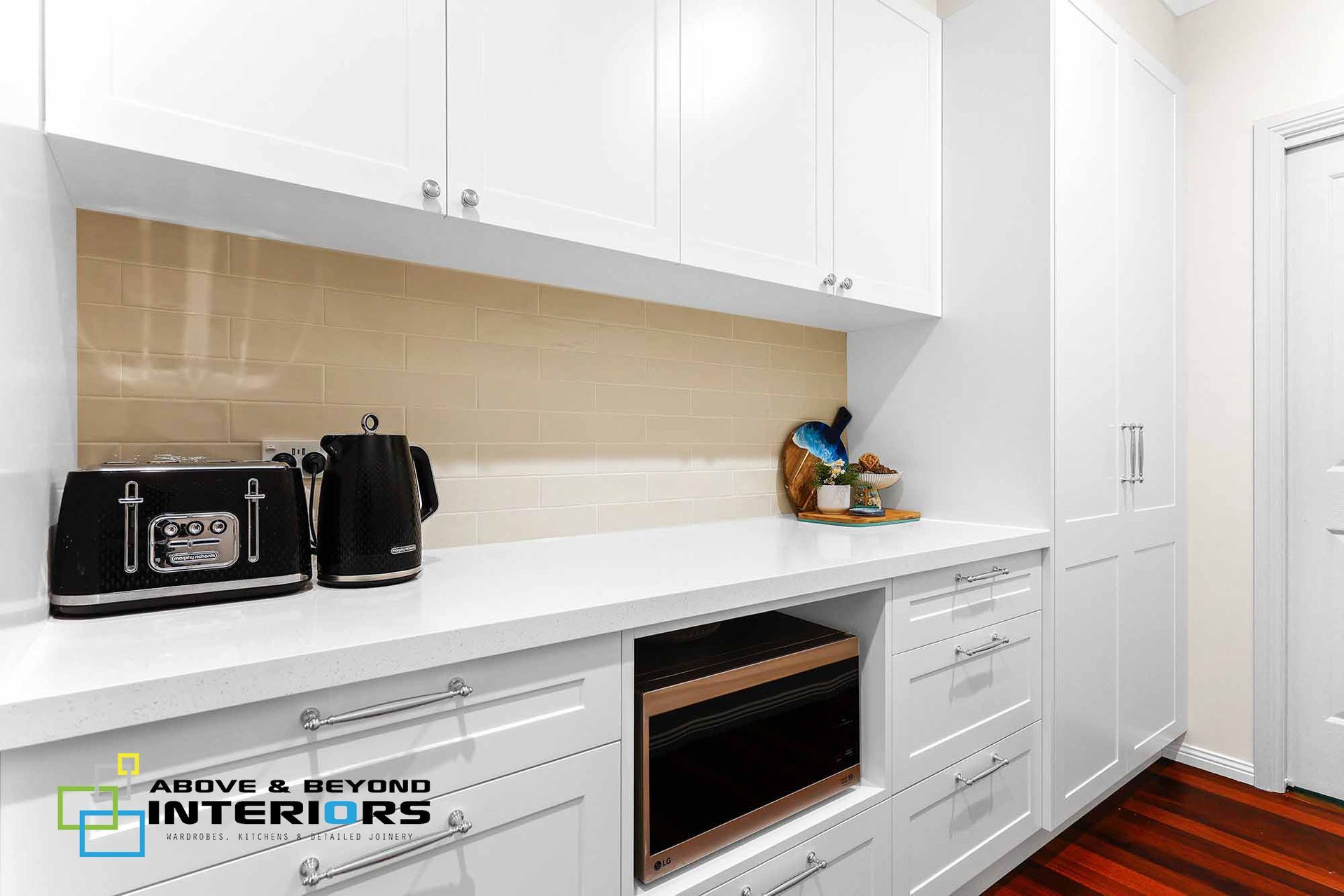White Kitchen Countertop with Toaster — Above & Beyond Interiors in Smeaton Grange, NSW