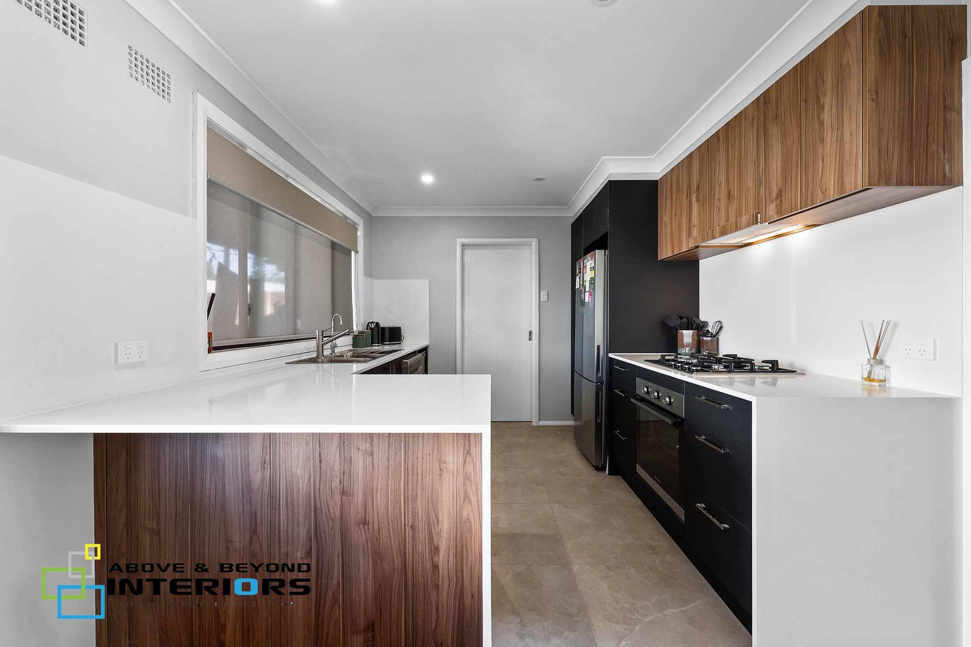 Modern Kitchen with White Counters, and Wood Cabinets — Above & Beyond Interiors in Smeaton Grange, NSW