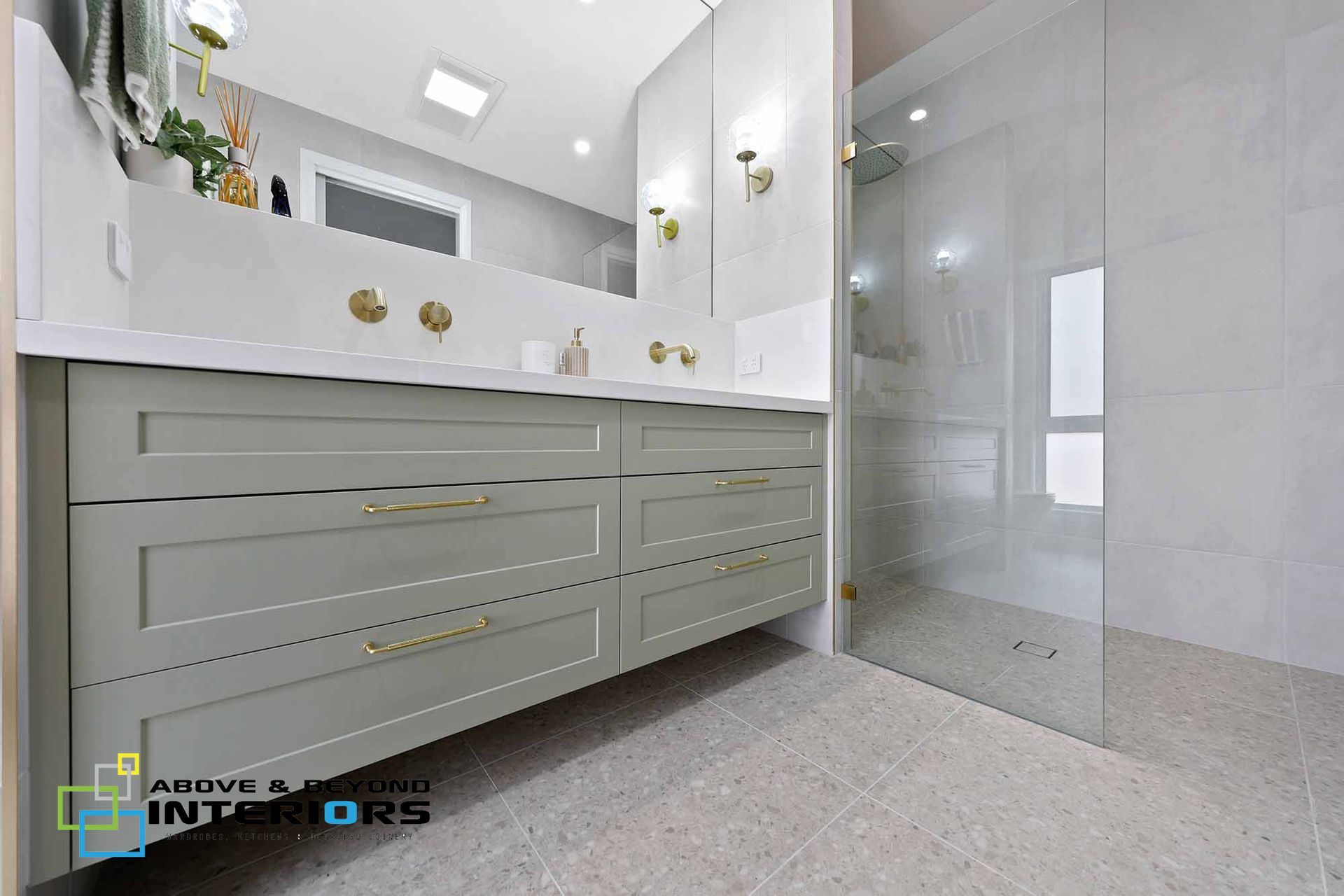 Modern Bathroom with Gray Vanity and Glass Shower Enclosure — Above & Beyond Interiors in Smeaton Grange, NSW