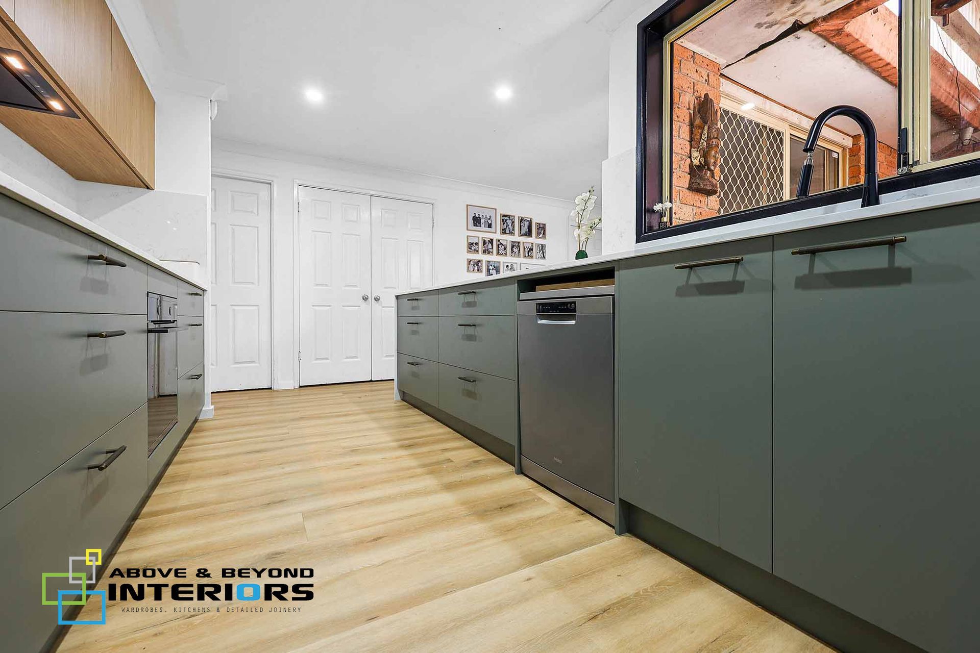 A Modern Kitchen with Gray Cabinets — Above & Beyond Interiors in Smeaton Grange, NSW