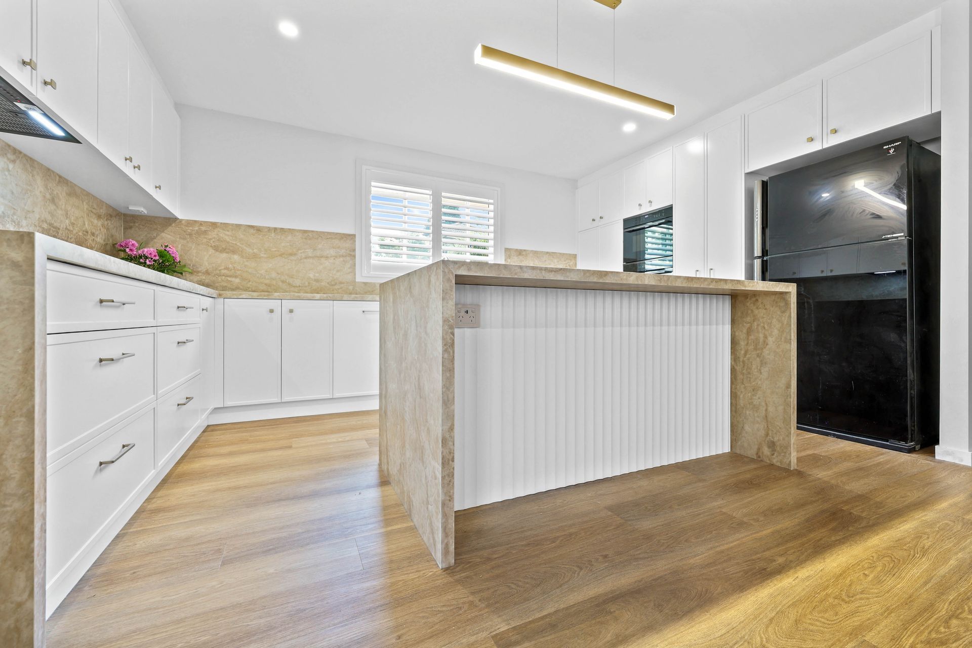 Bright Modern Kitchen With White Cabinets — Above & Beyond Interiors in Smeaton Grange, NSW