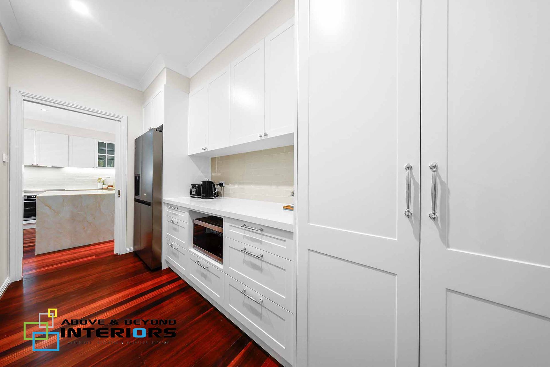 Bright White Hallway Kitchen with Built-In Cabinets — Above & Beyond Interiors in Smeaton Grange, NSW