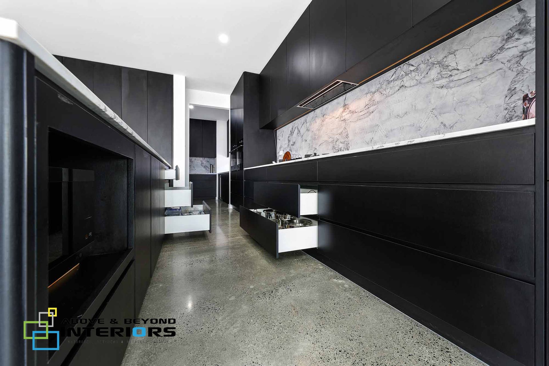 Modern Black-And-White Kitchen with Marble Backsplash — Above & Beyond Interiors in Smeaton Grange, NSW