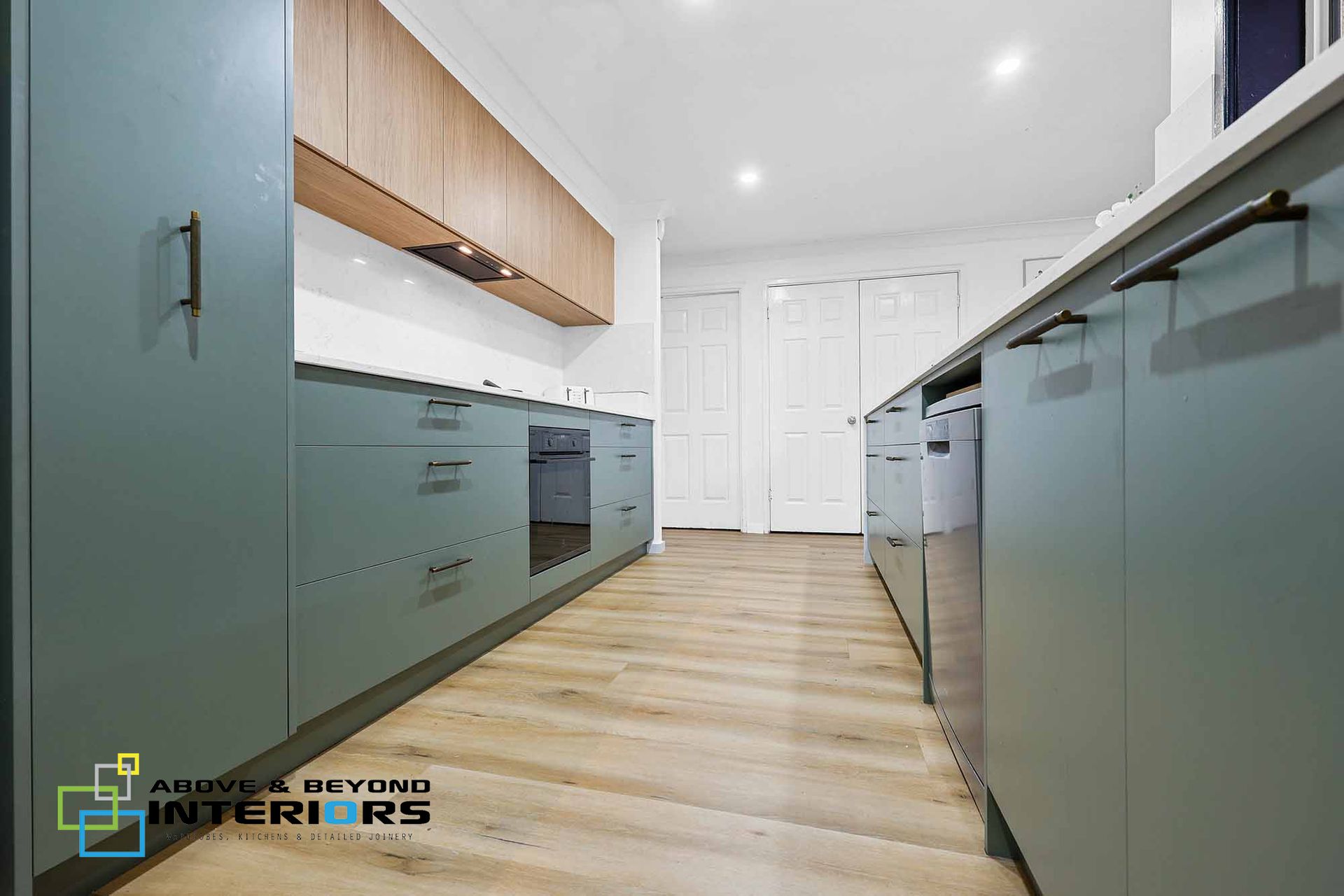 Modern Kitchen with Mint Cabinets — Above & Beyond Interiors in Smeaton Grange, NSW