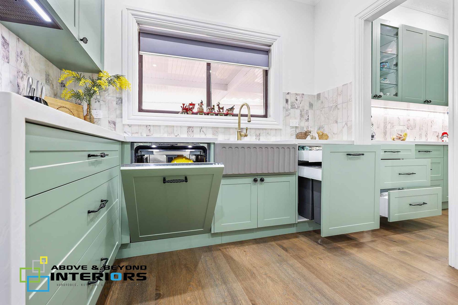 A Kitchen with White Counters — Above & Beyond Interiors in Smeaton Grange, NSW
